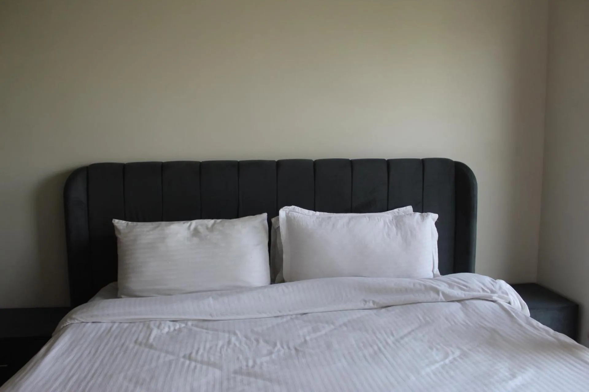 Bed in The Opus Luxury Residences