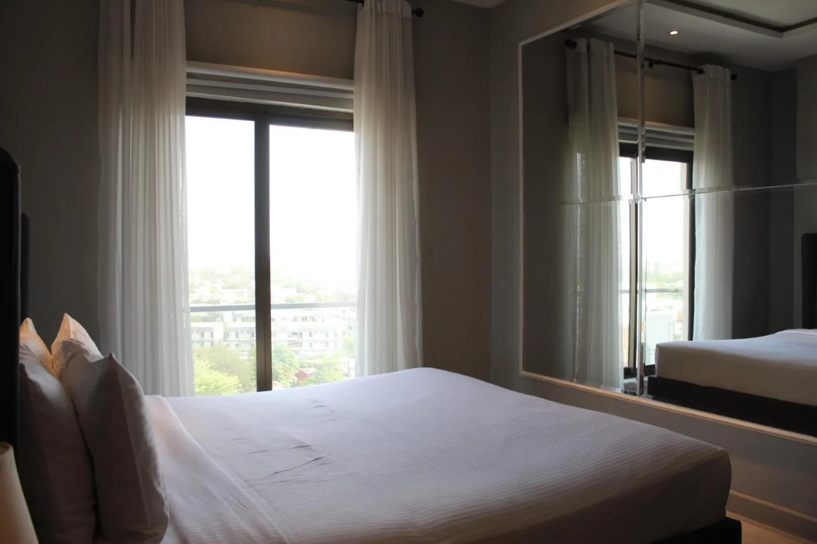 Bed in The Opus Luxury Residences