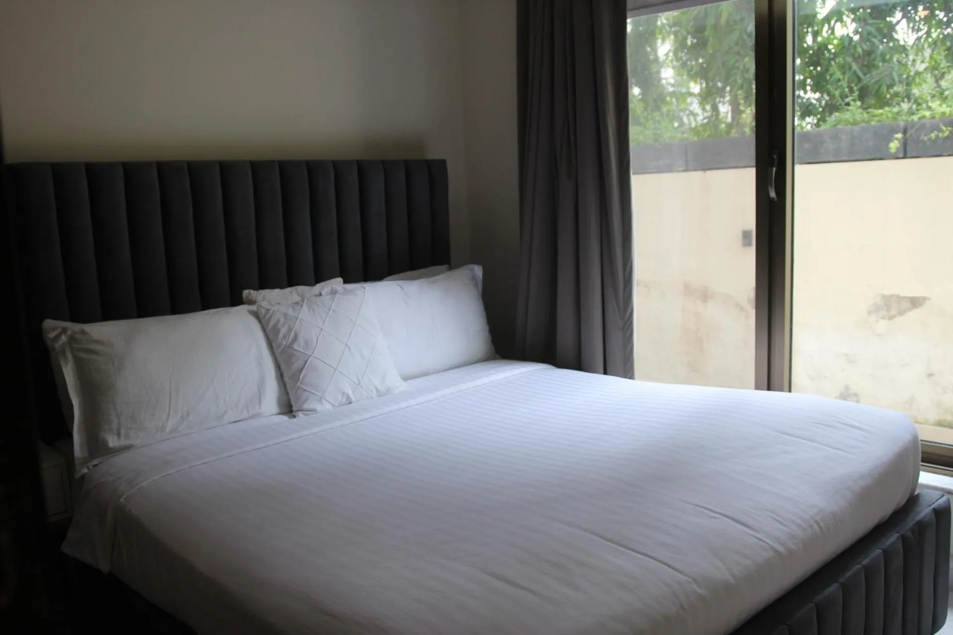 Bed in The Opus Luxury Residences