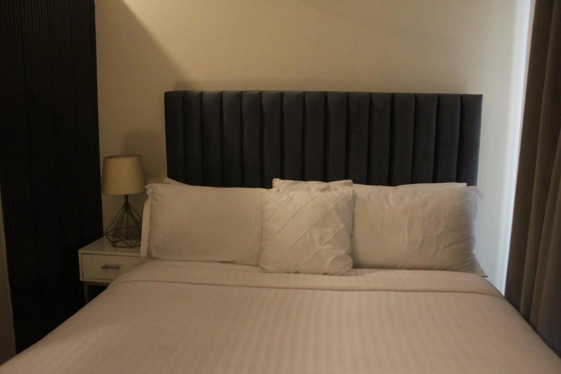 Bed in The Opus Luxury Residences