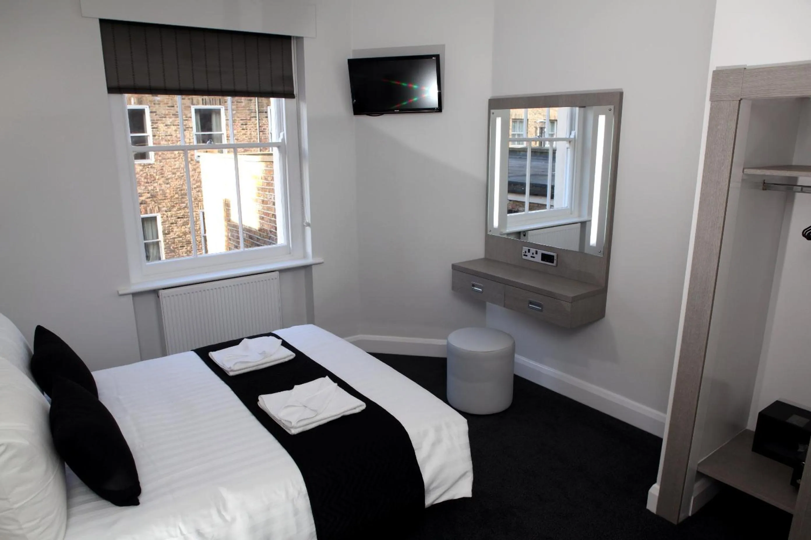 Photo of the whole room, Bed in The Omega Hotel