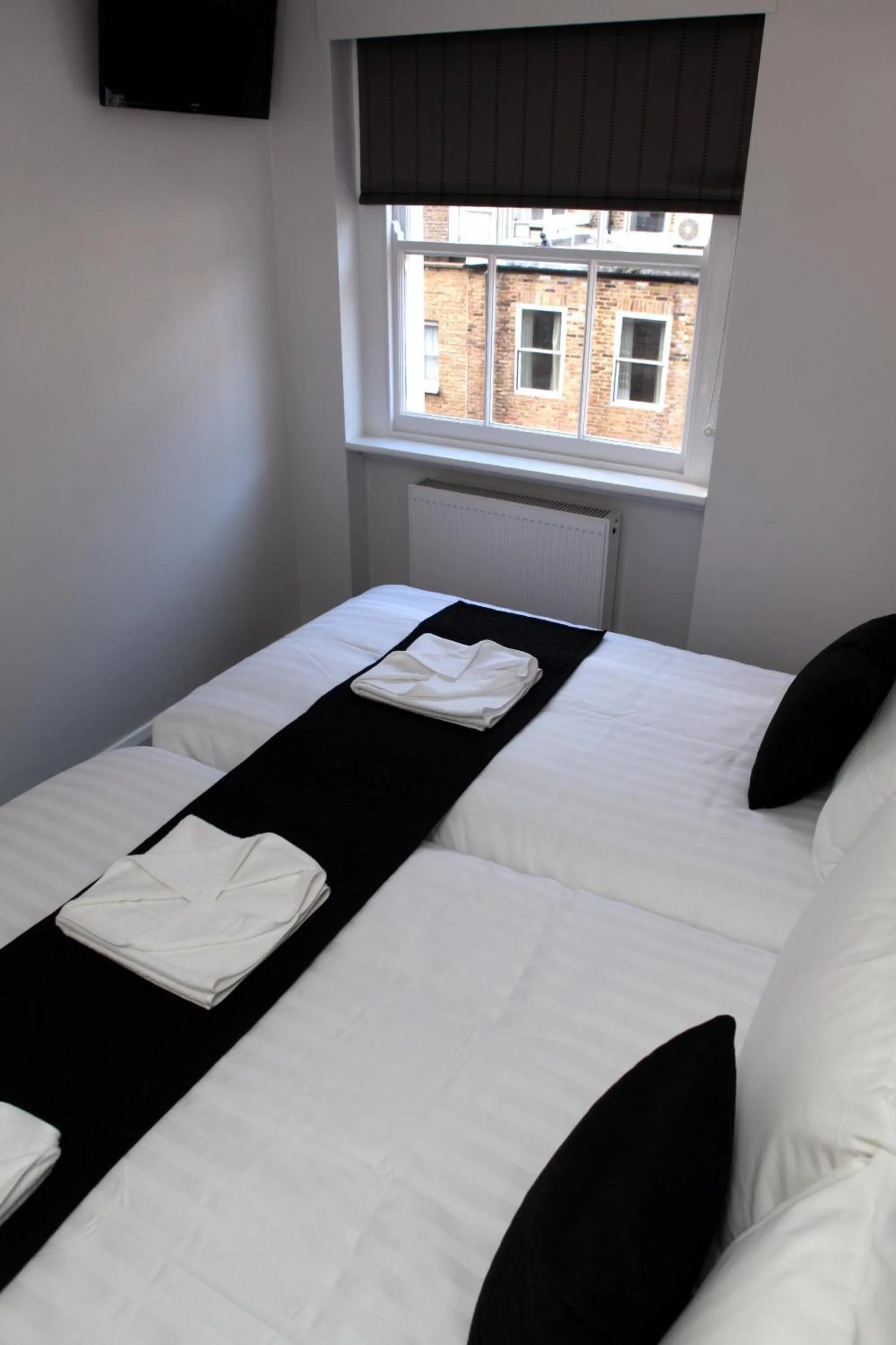 Photo of the whole room, Bed in The Omega Hotel