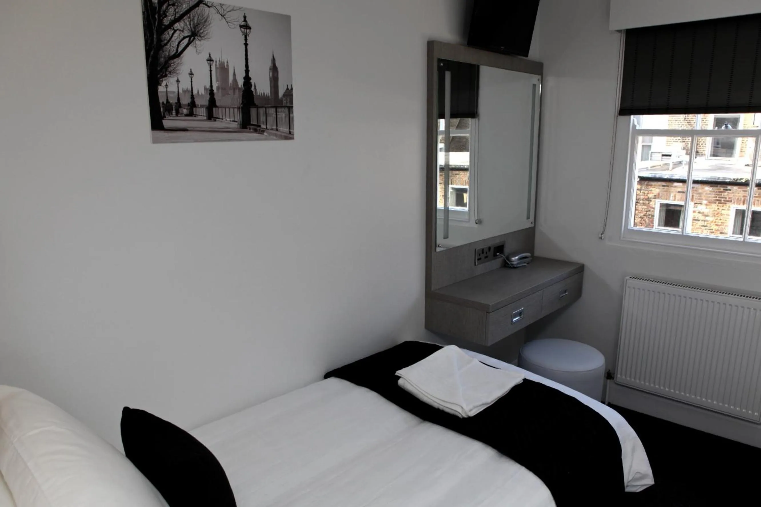 Photo of the whole room, Bed in The Omega Hotel