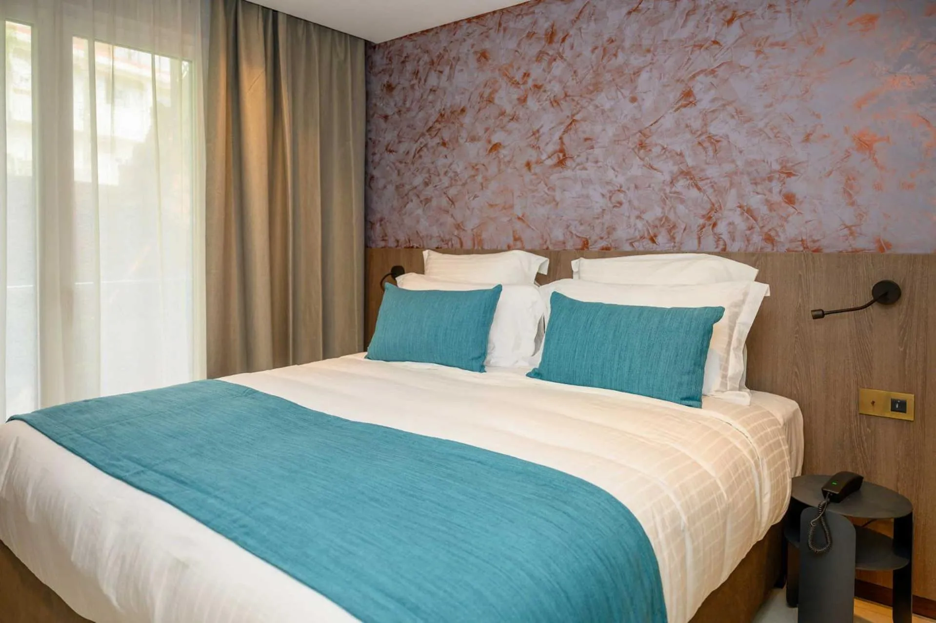 Bed in Sable Bleu Boutique Hotel