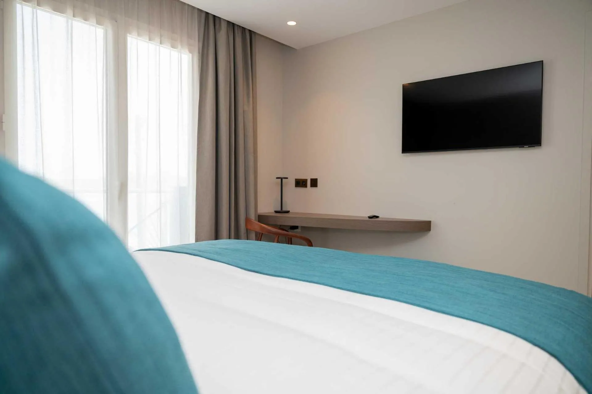 Bed in Sable Bleu Boutique Hotel