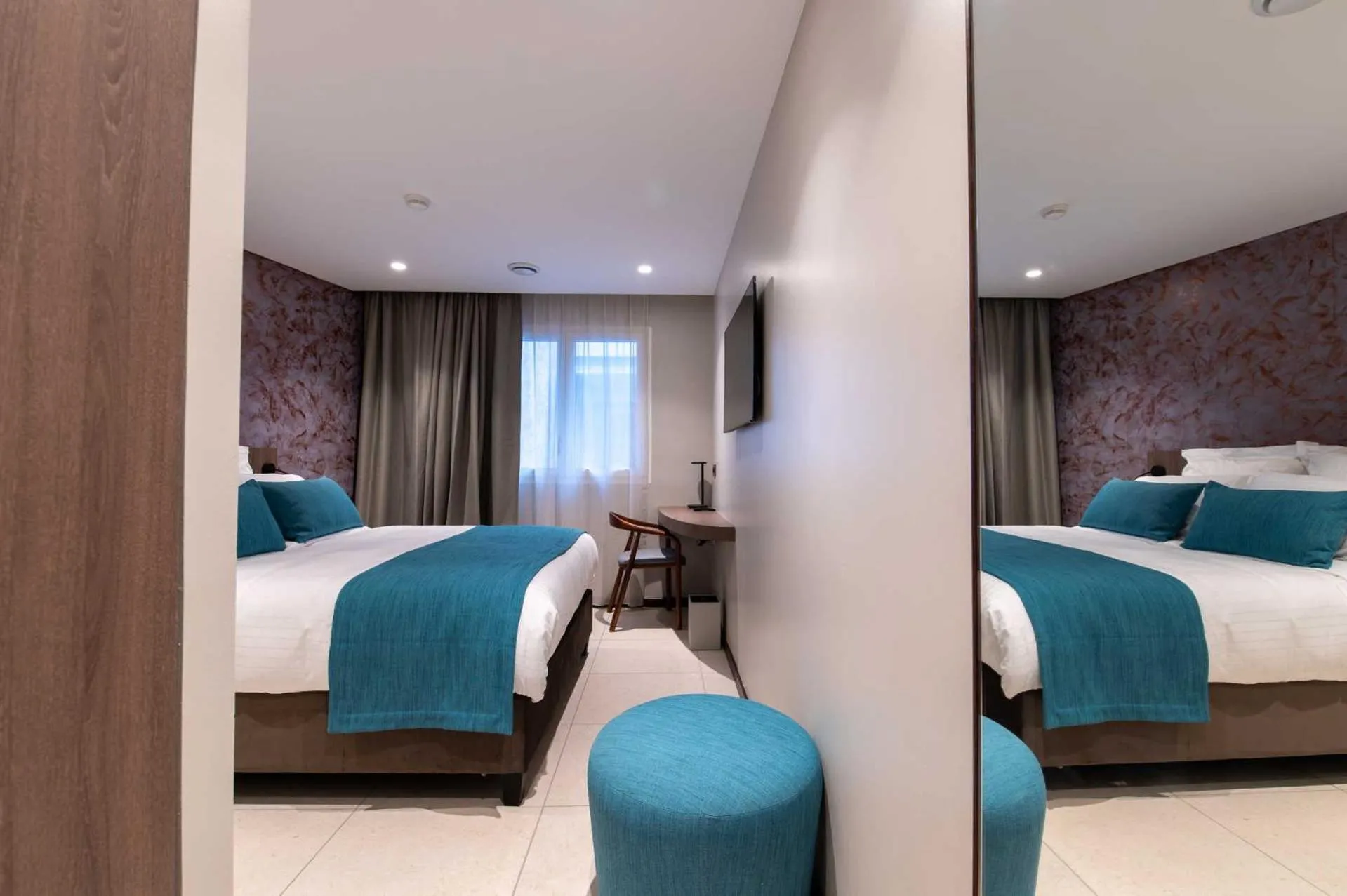 Bed in Sable Bleu Boutique Hotel