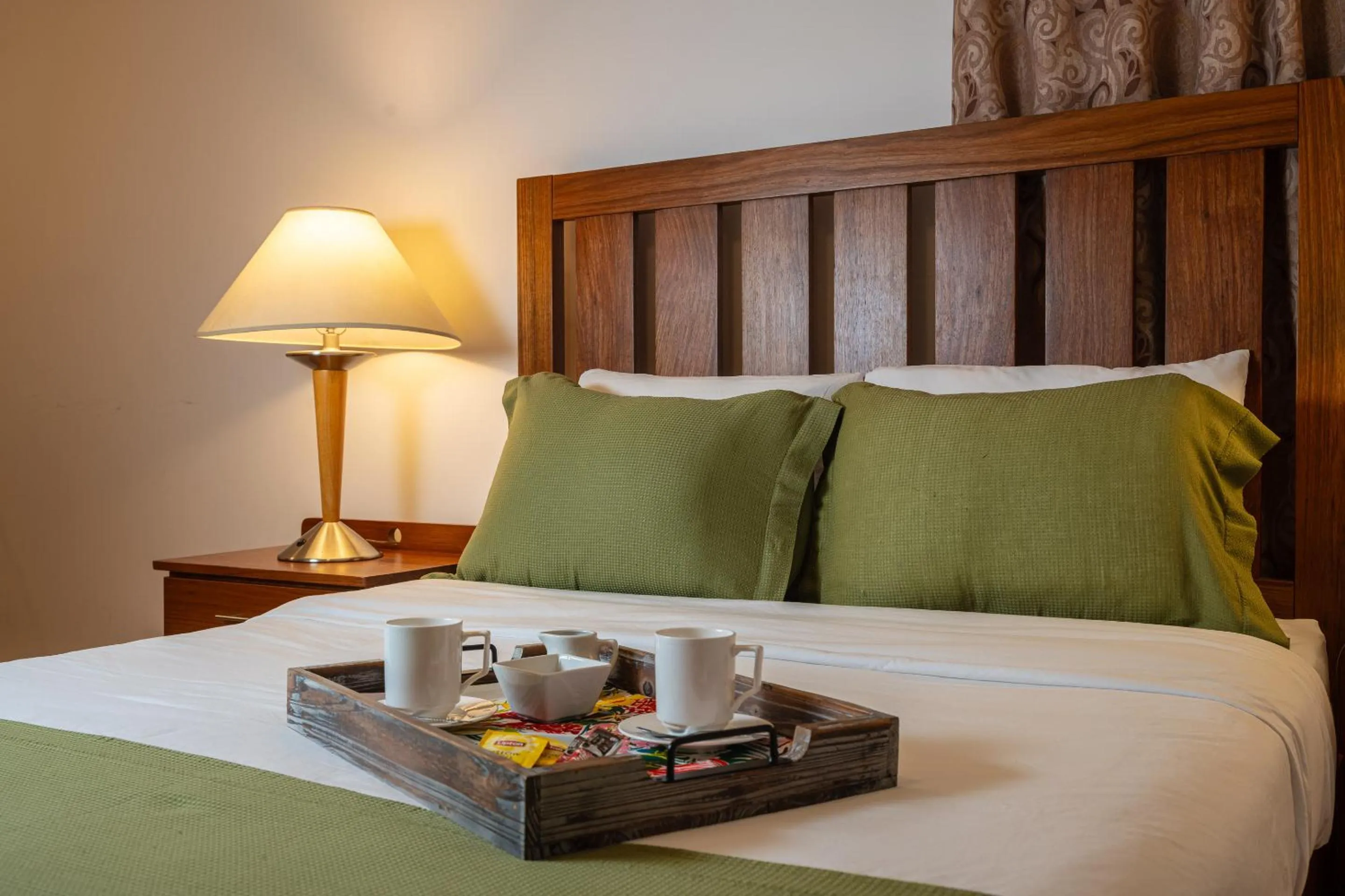 Bed in Grand Coastal Hotel