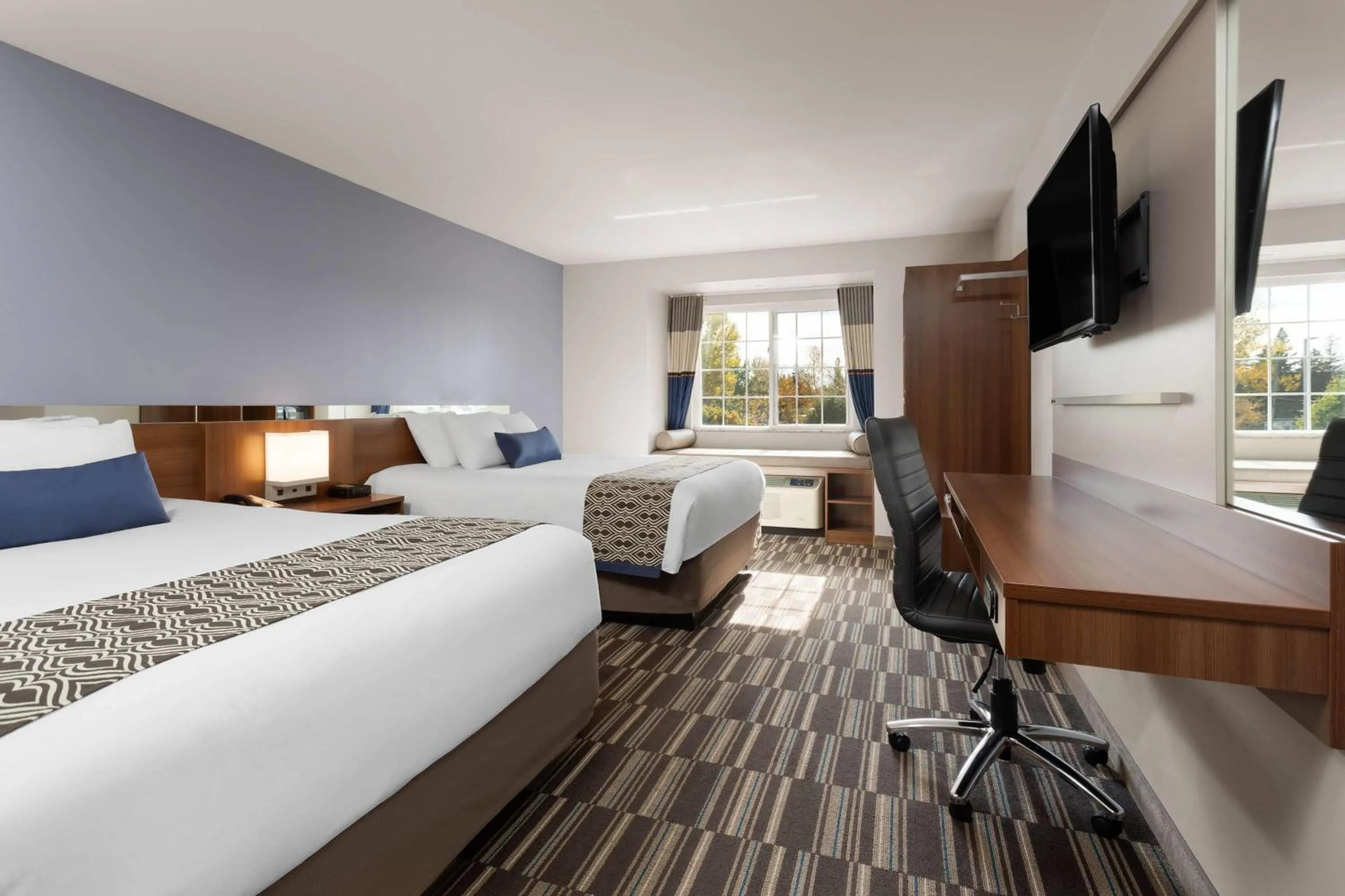 Photo of the whole room, Bed in Microtel Inn & Suites Sault Ste. Marie