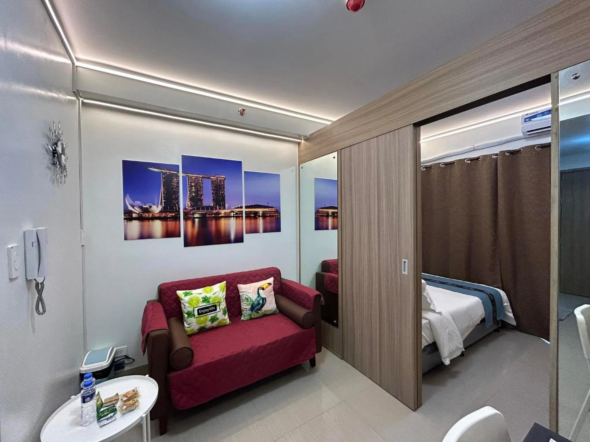 Living room, Bed in Shore Residences MOA Dynastel Staycation