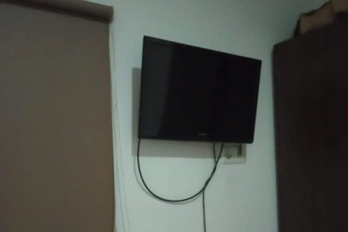 Bedroom in Hotel O White House SyariahNearOYO 93457 White House Syariah