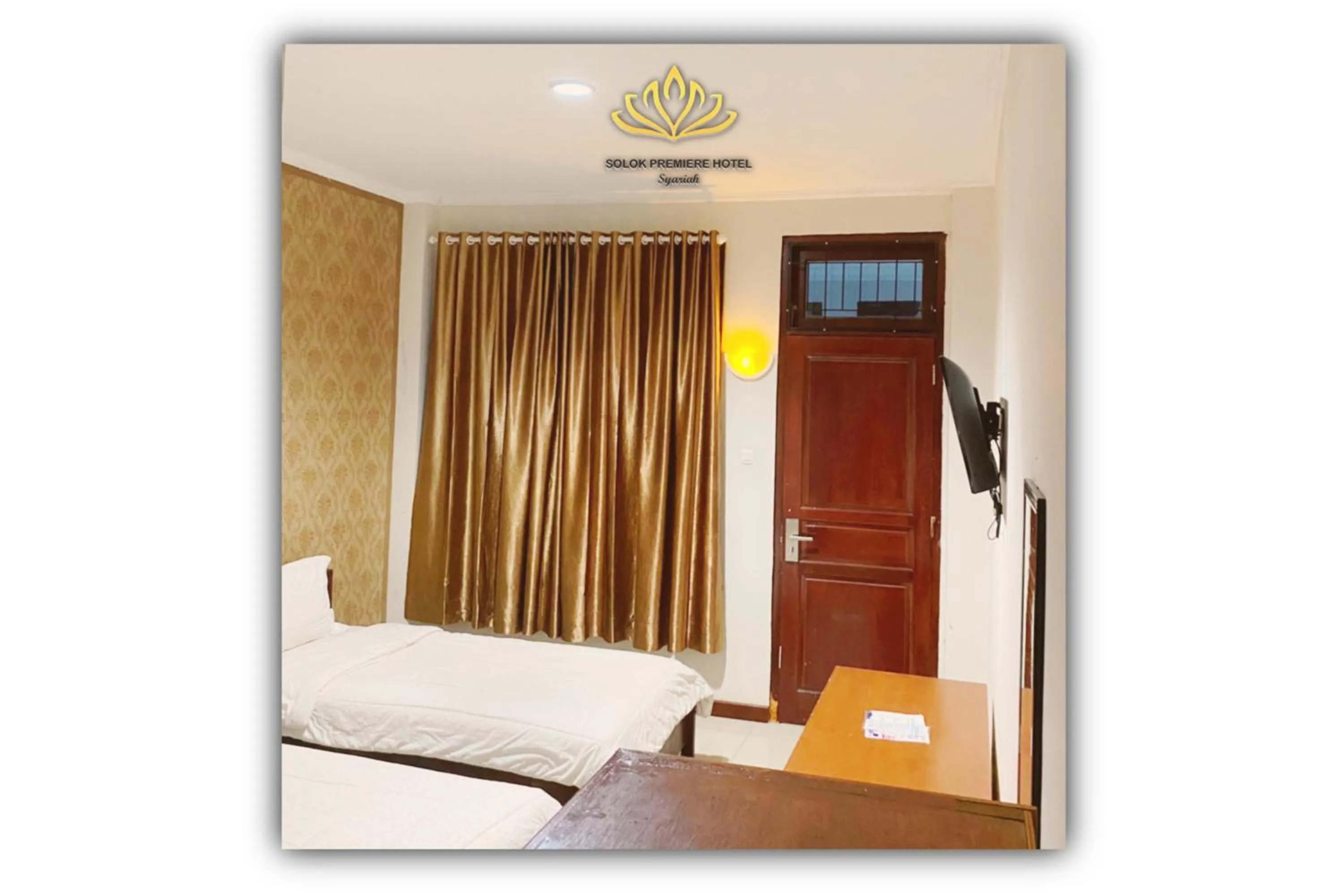 Bed in Solok Premier Hotel