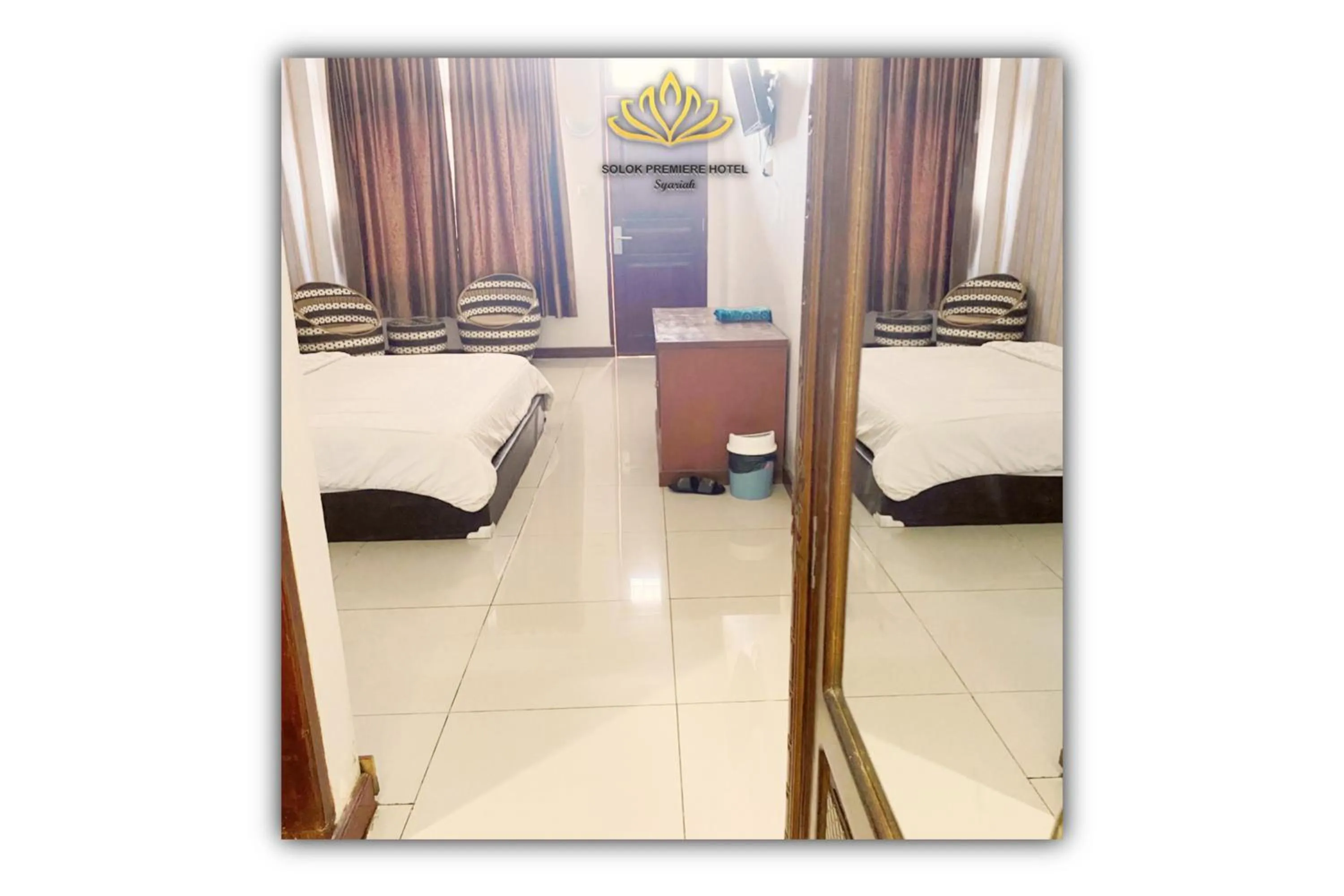 Bed in Solok Premier Hotel