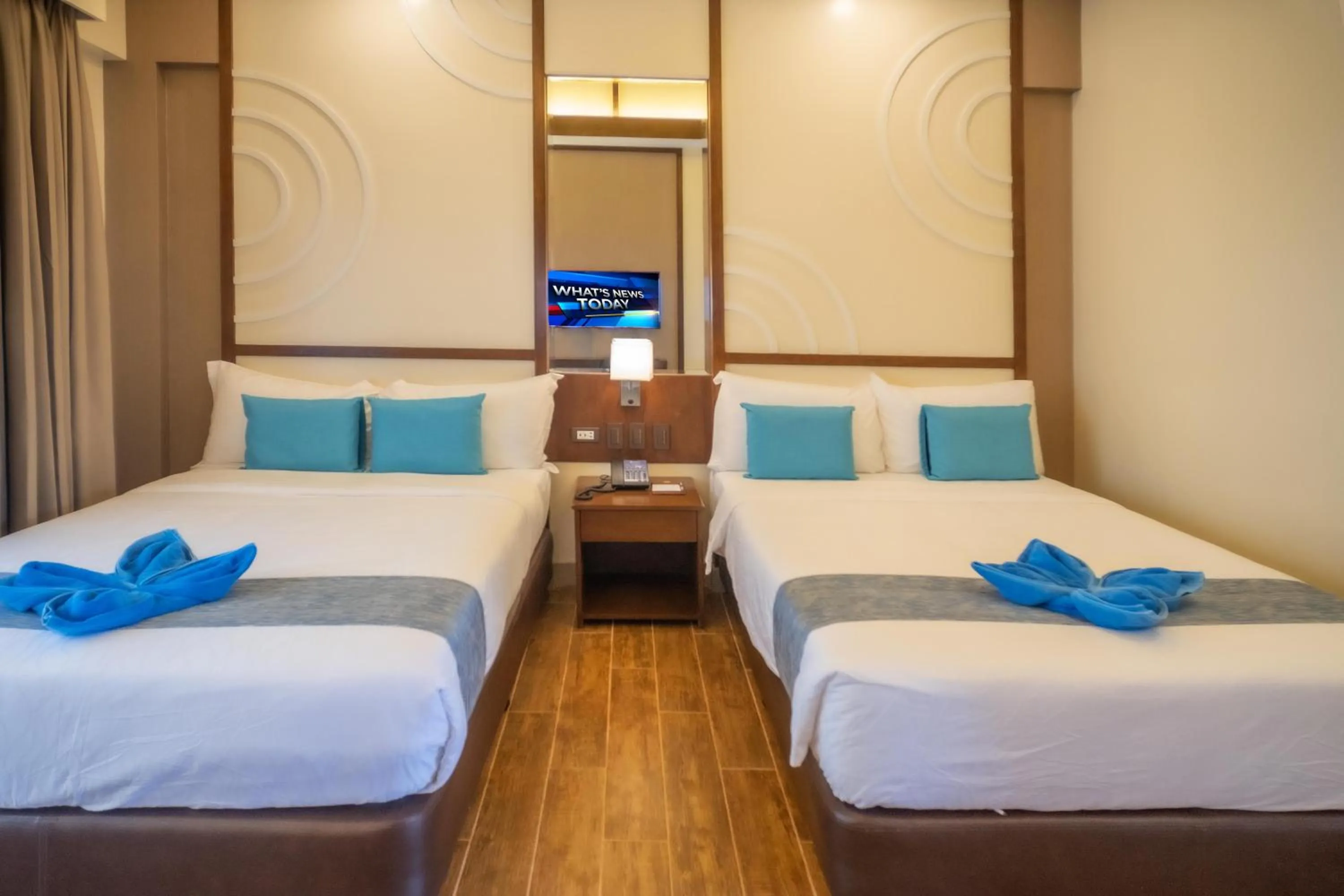 Bed in Parklane Bohol Resort and Spa