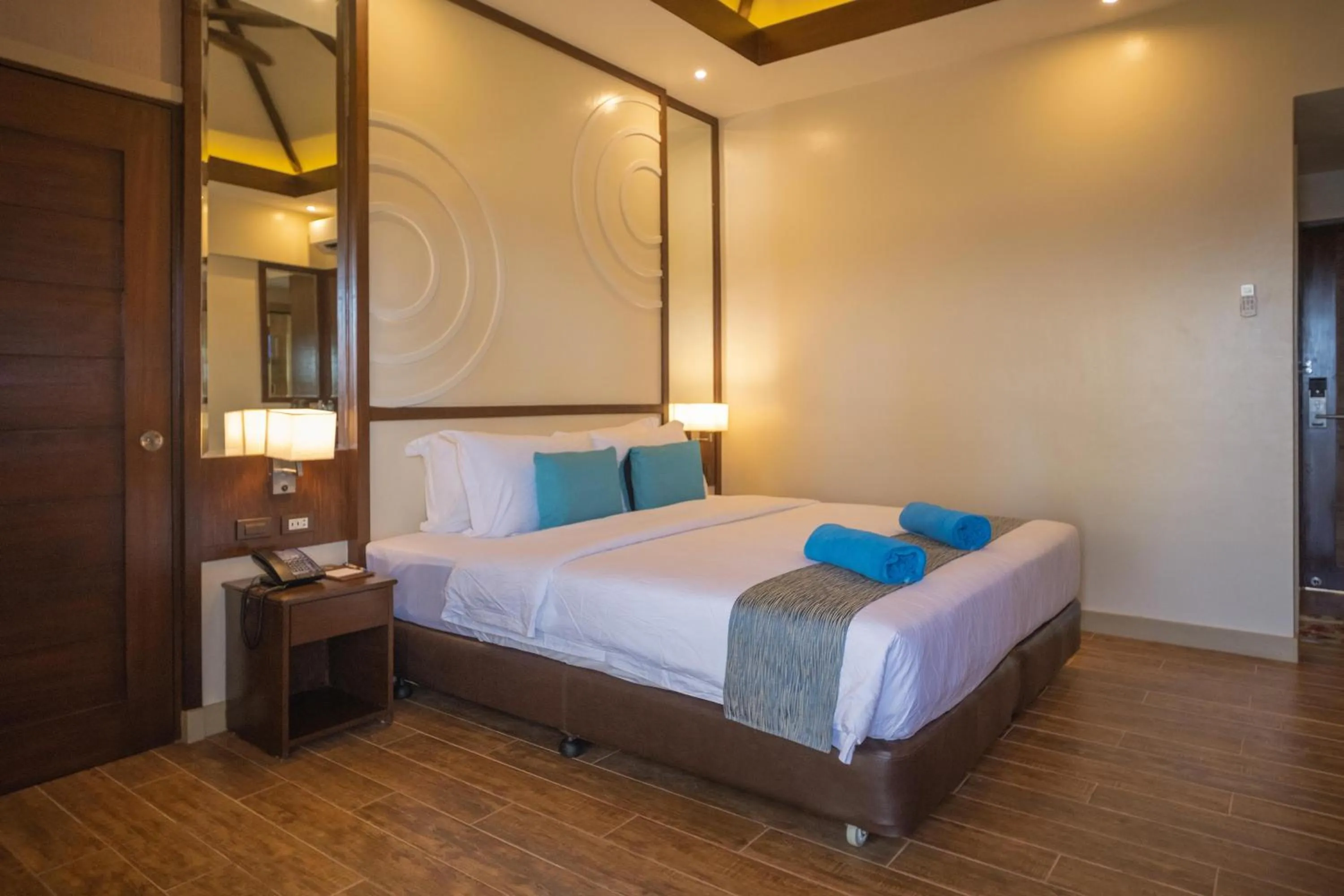 Bed in Parklane Bohol Resort and Spa