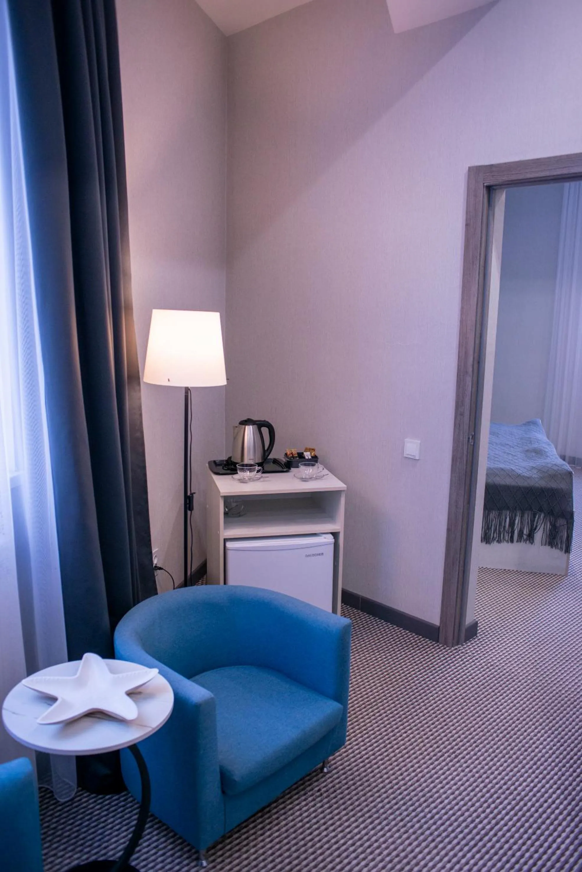 Living room, Bed in Tengri Hotel