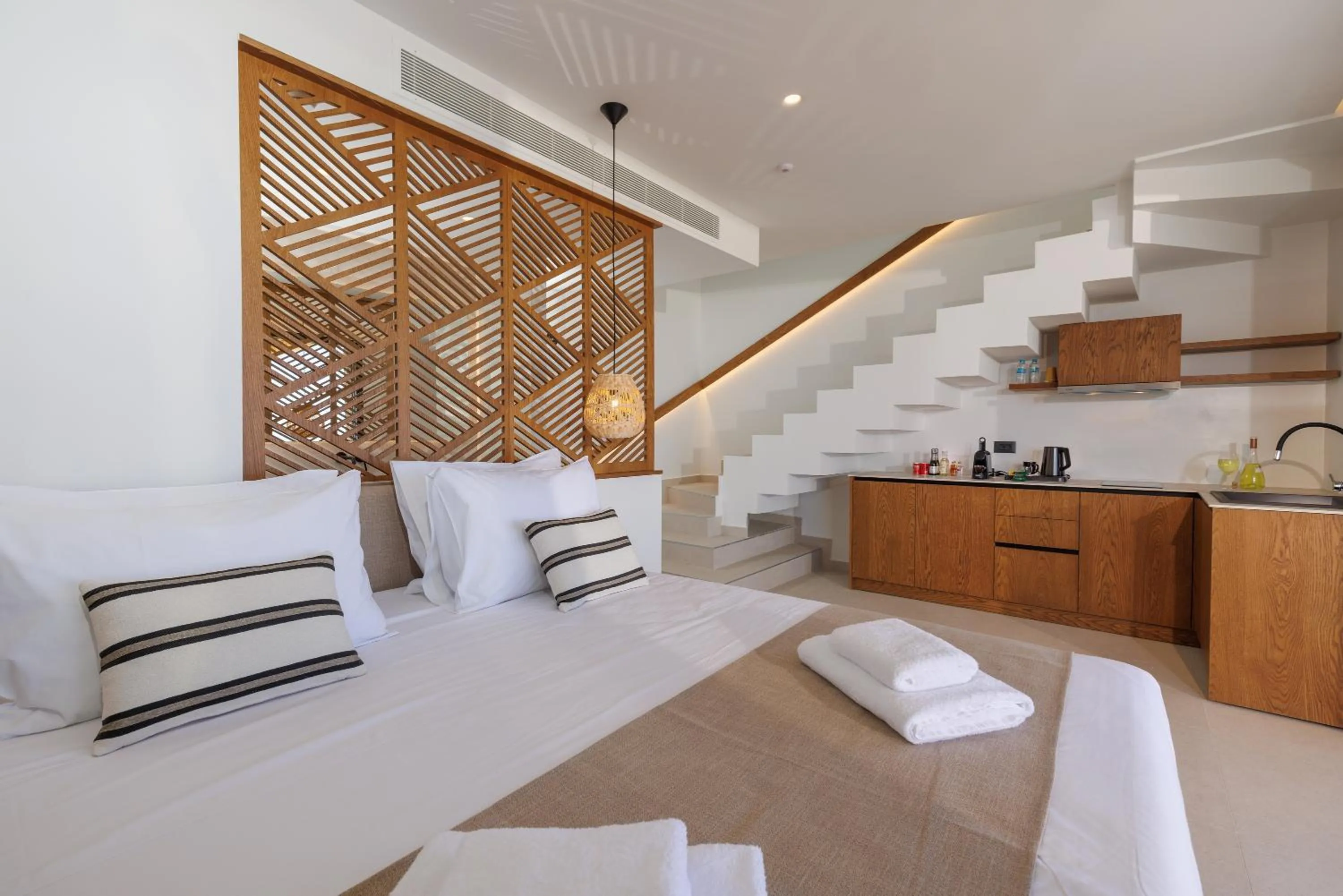 Bed in Deos Luxury Suites - Adults Only