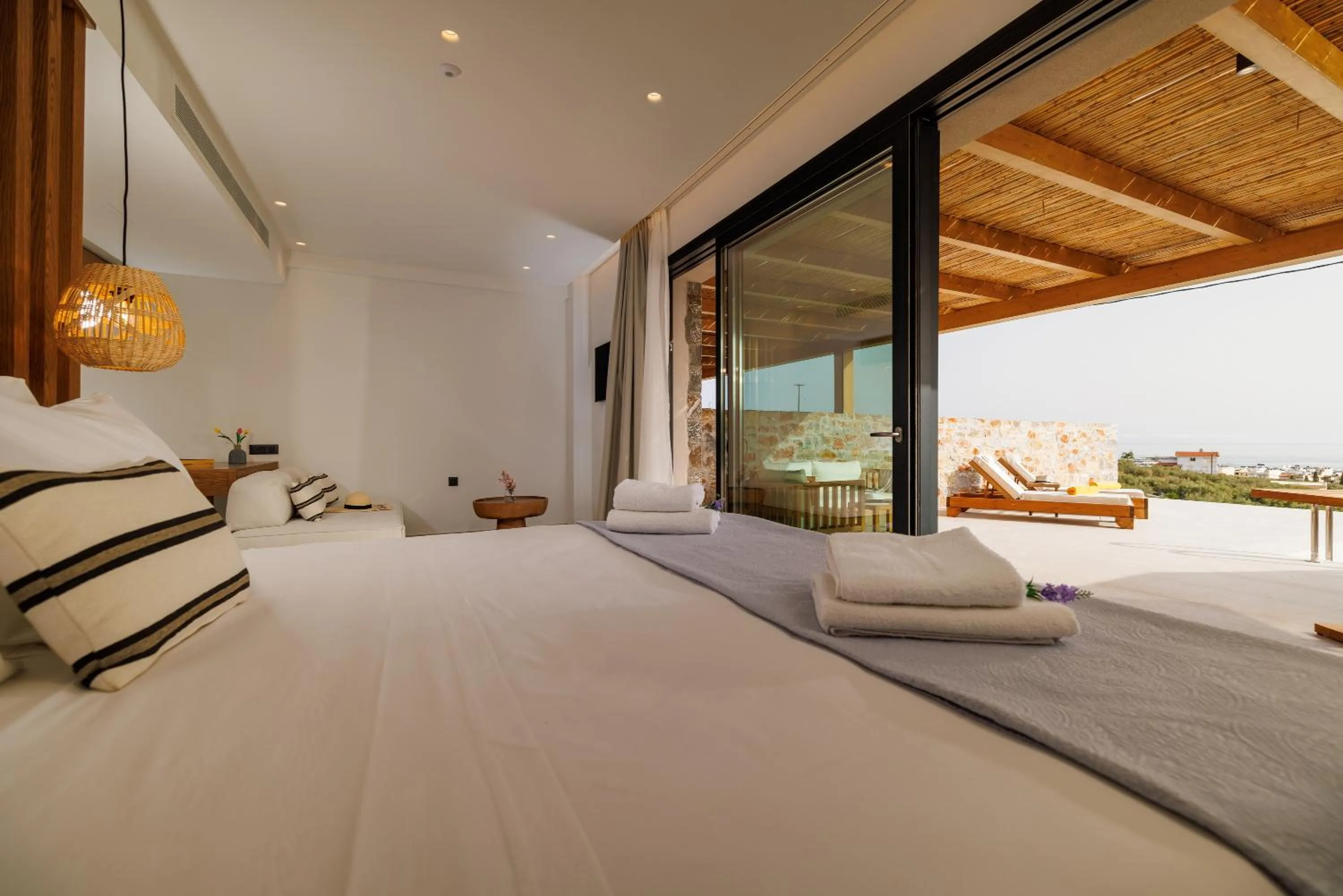 Bed in Deos Luxury Suites - Adults Only