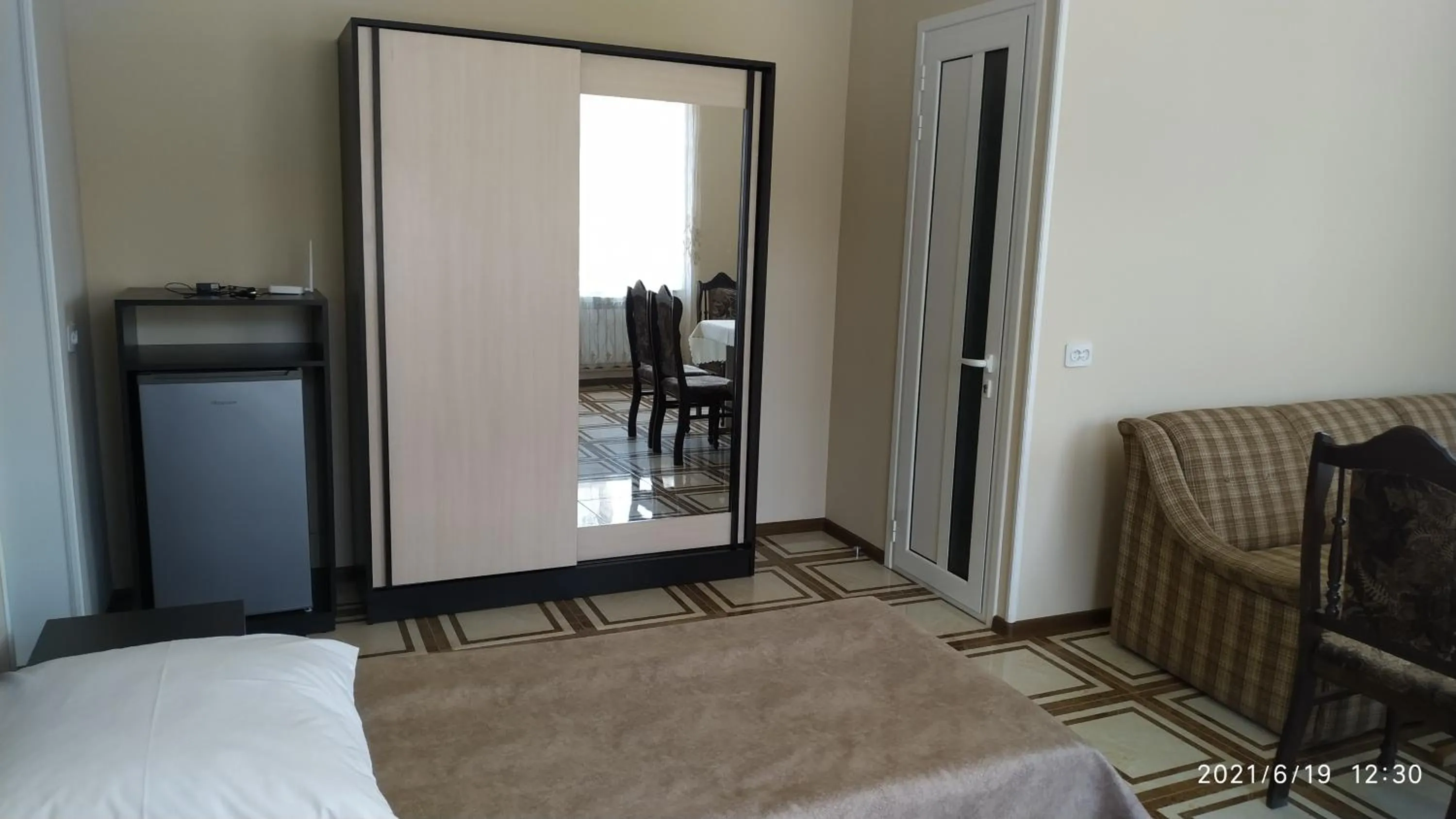 Communal lounge/ TV room, Bed in Erazank Hotel