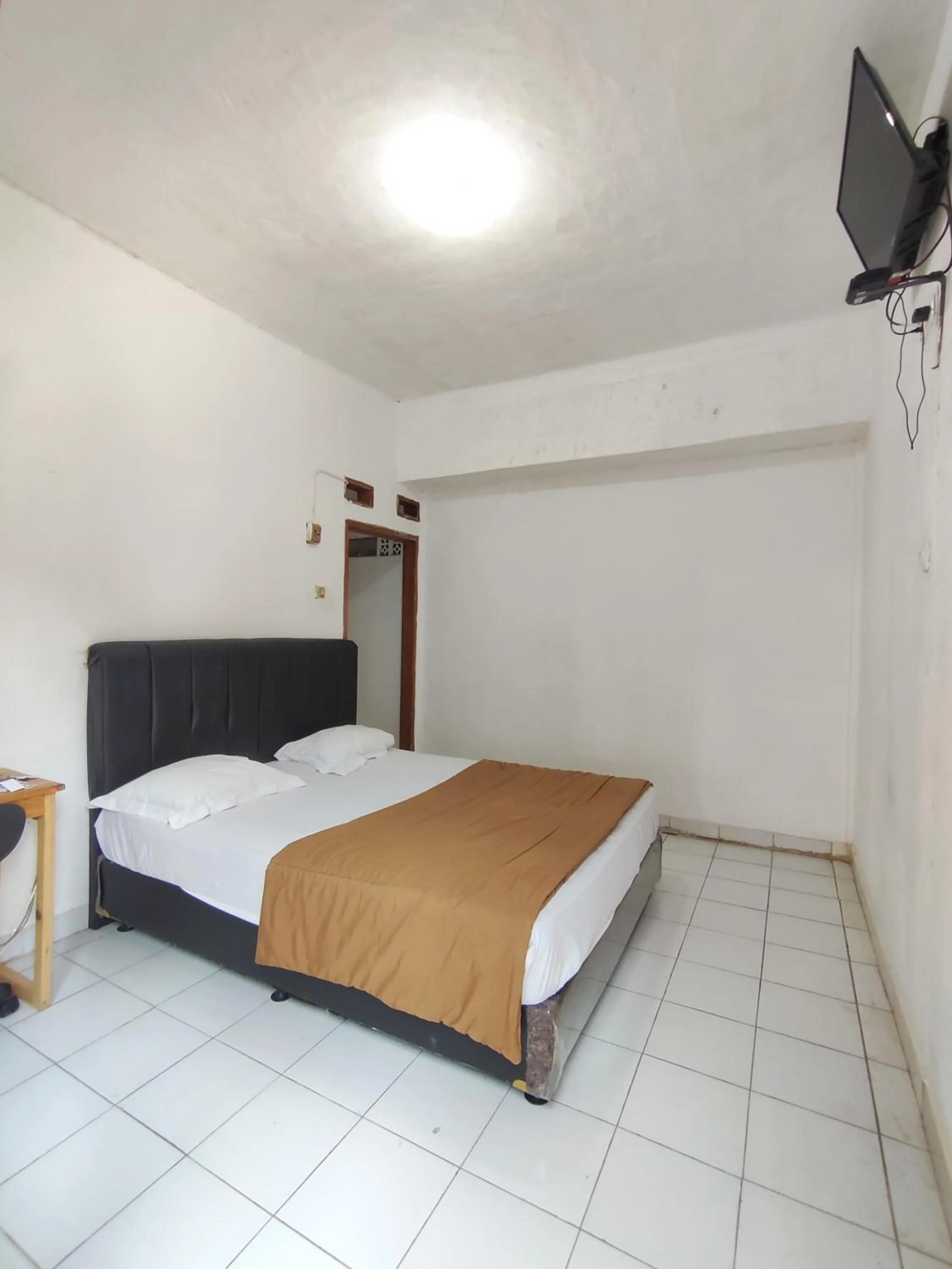 Bed in Penginapan Nurmega jaya