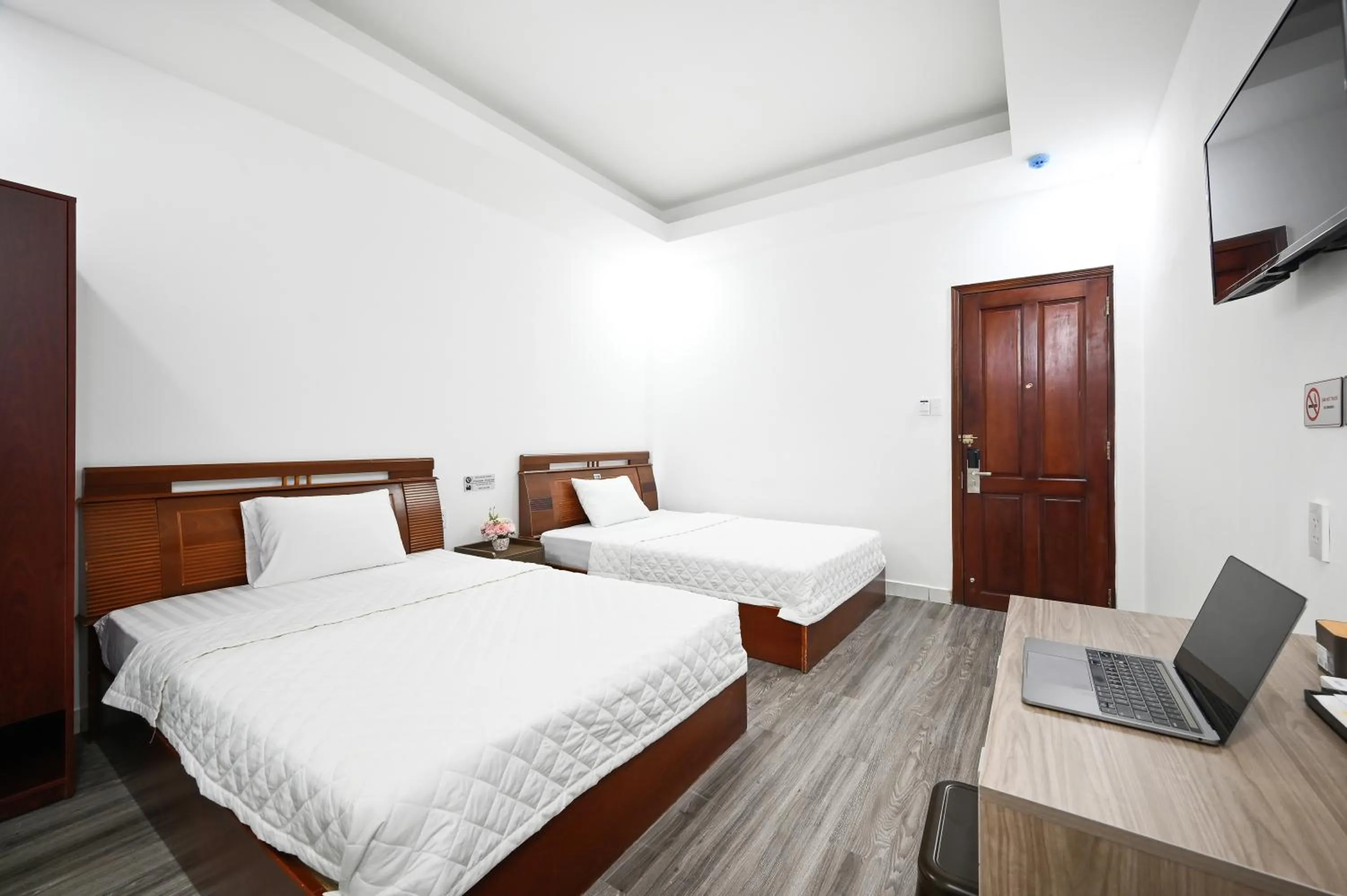 Bed in YoKo Airport Saigon Hotel