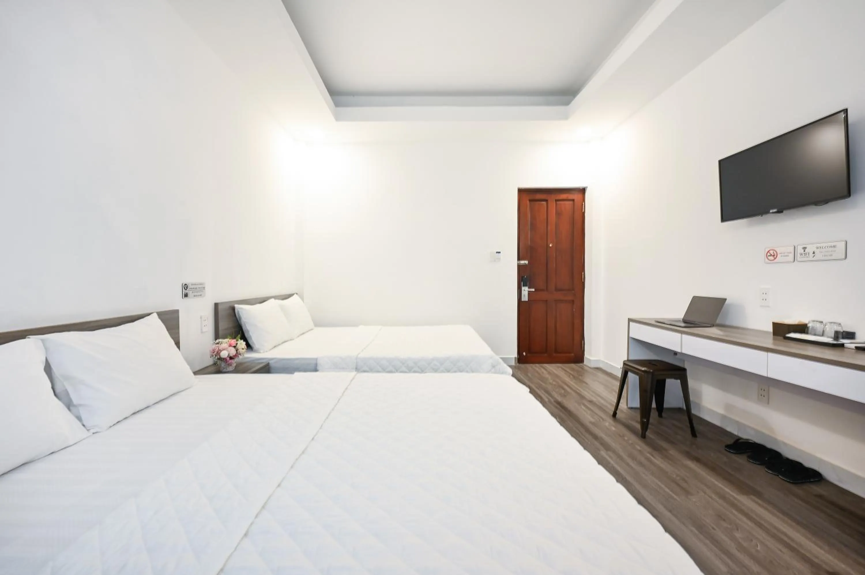 Bed in YoKo Airport Saigon Hotel