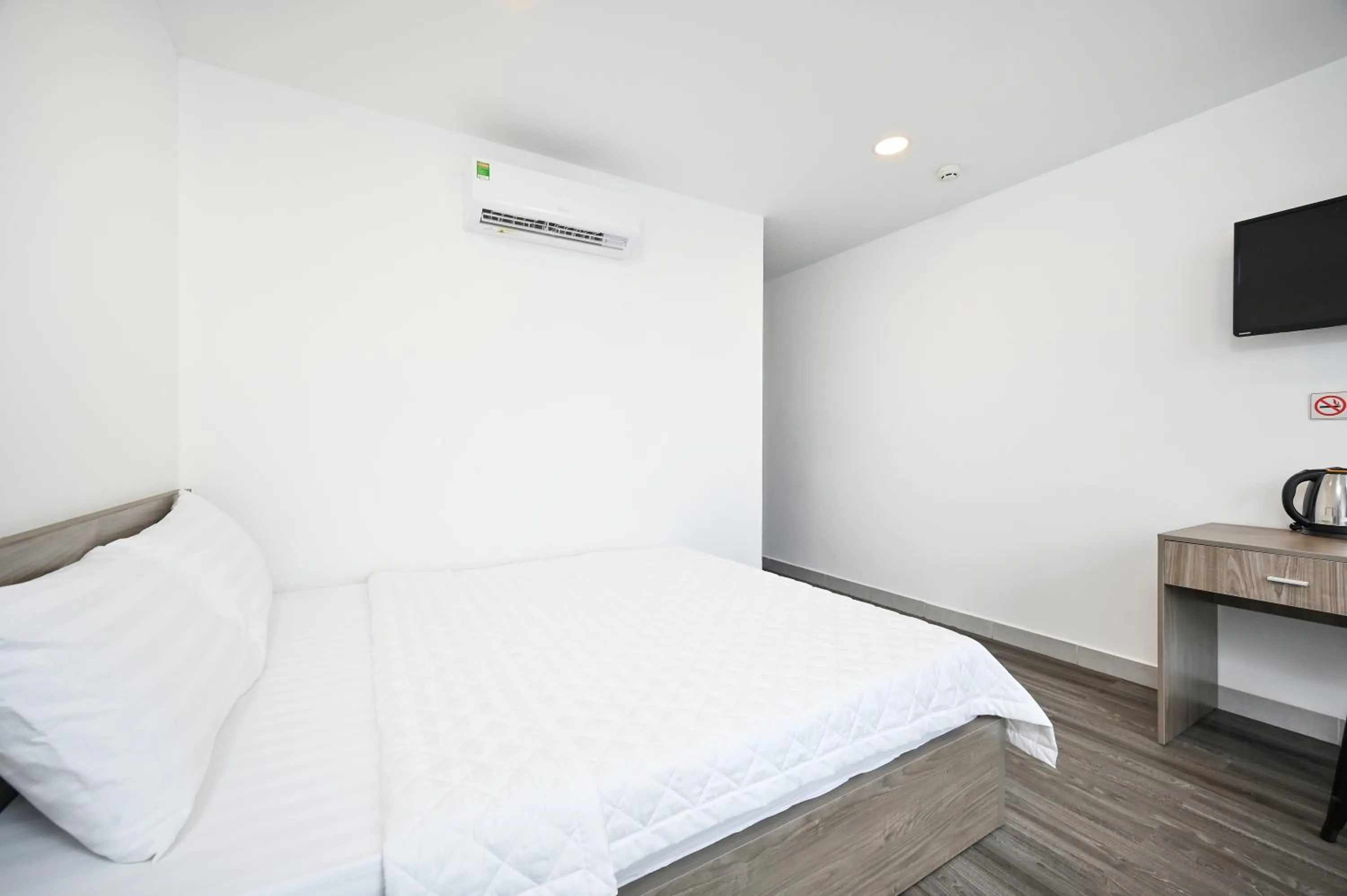 Bed in YoKo Airport Saigon Hotel