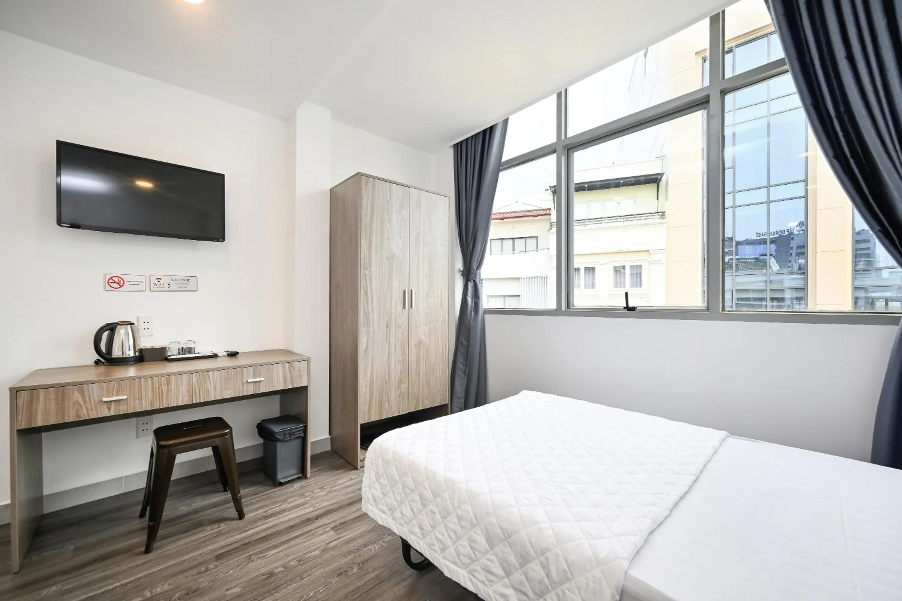 Bed in YoKo Airport Saigon Hotel