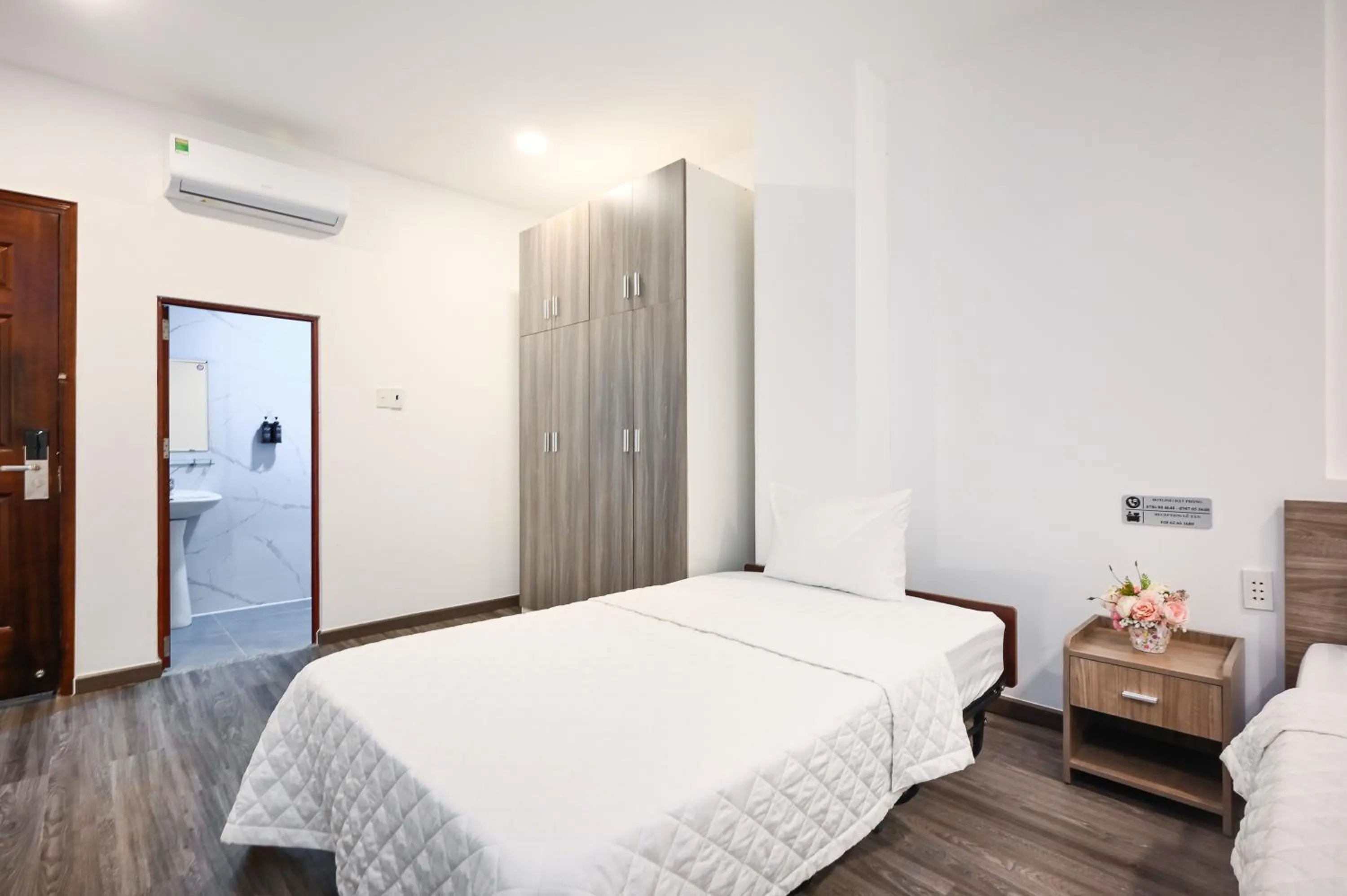 Bed in YoKo Airport Saigon Hotel