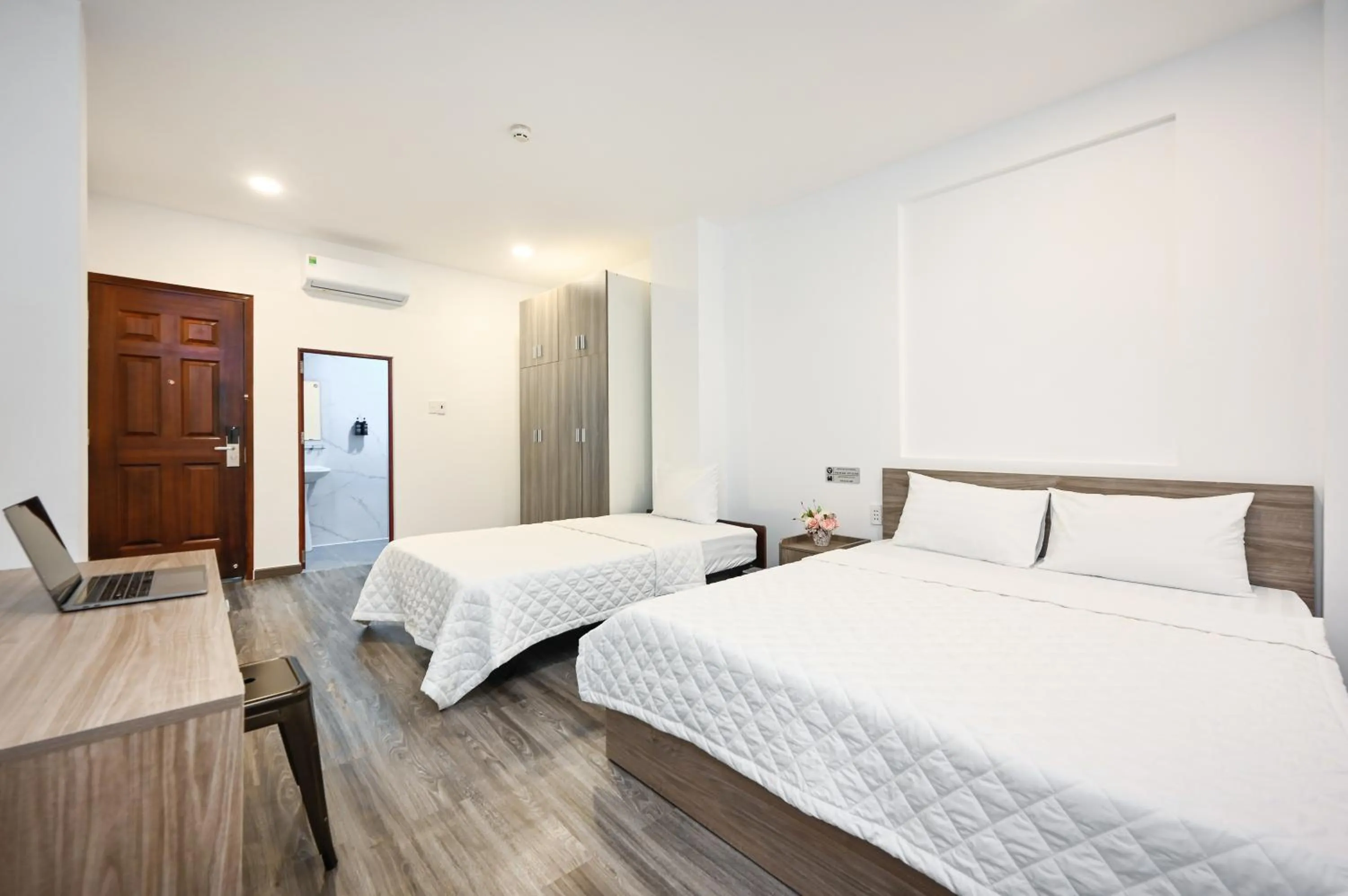 Bed in YoKo Airport Saigon Hotel