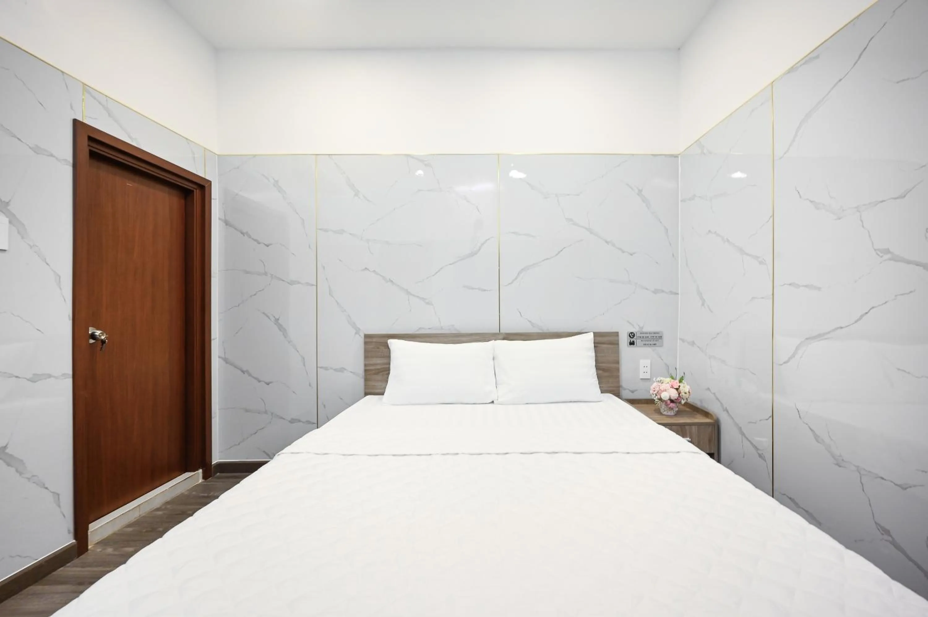 Bed in YoKo Airport Saigon Hotel