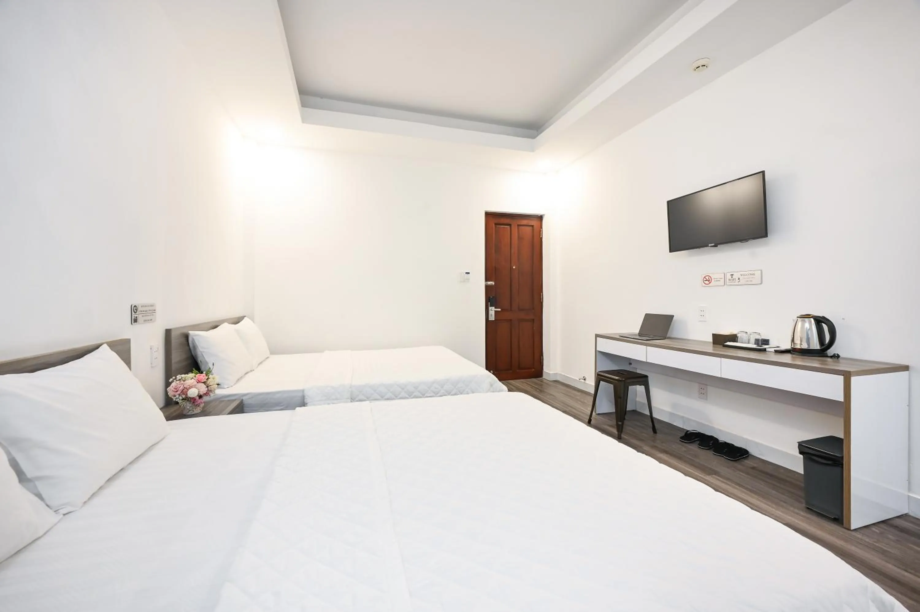 Bed in YoKo Airport Saigon Hotel