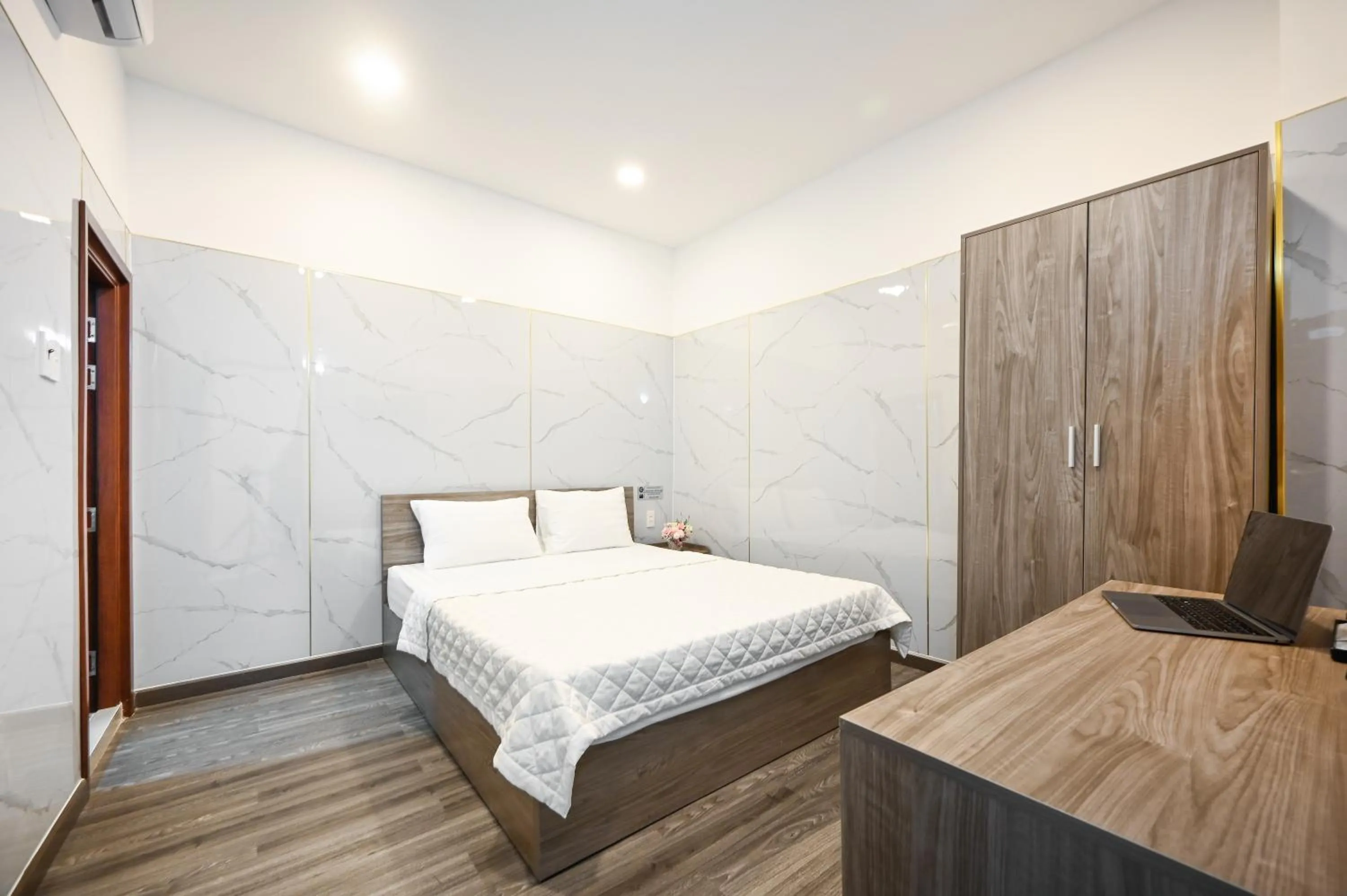 Bed in YoKo Airport Saigon Hotel