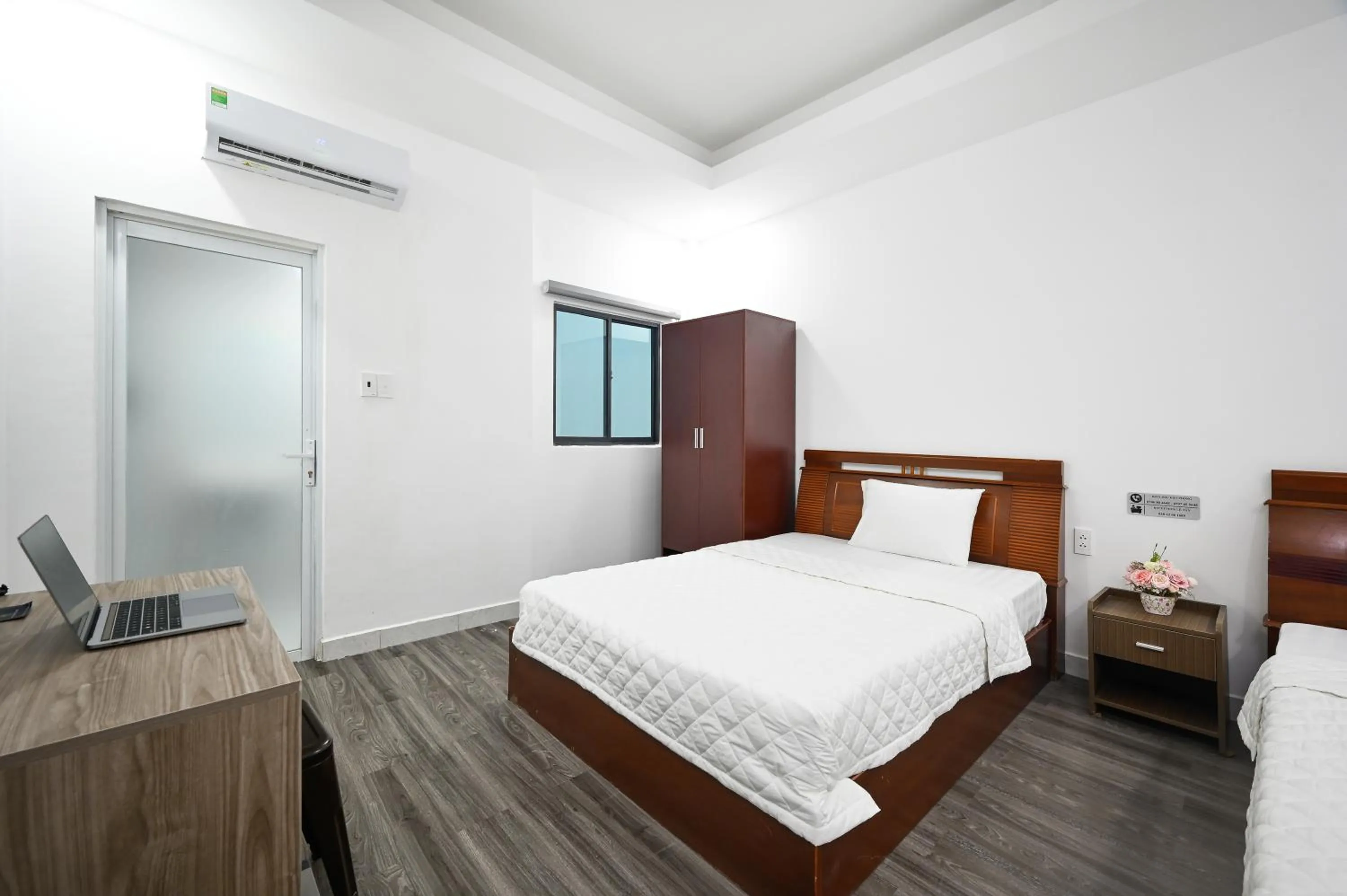 Photo of the whole room, Bed in YoKo Airport Saigon Hotel