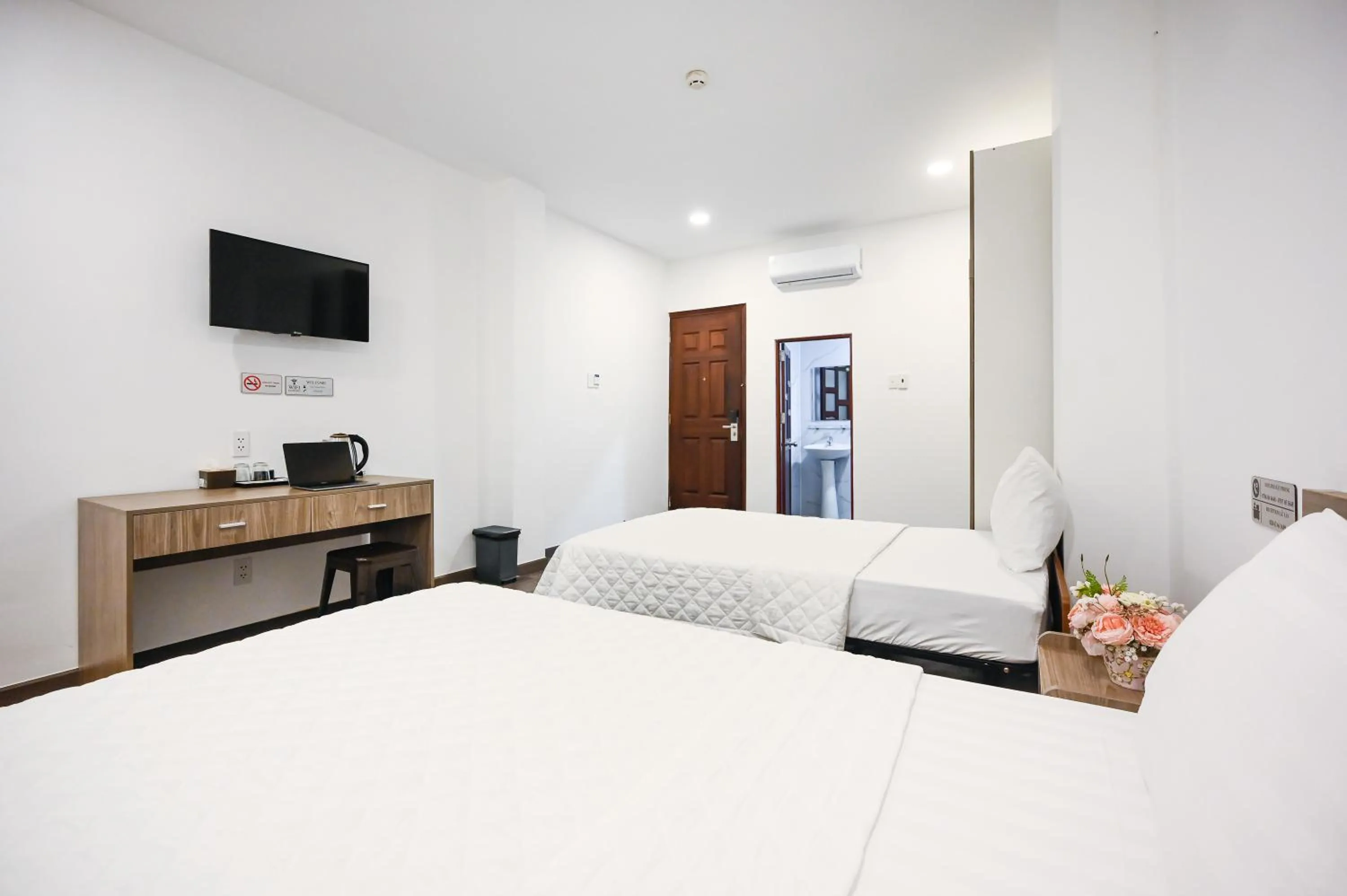 Photo of the whole room, Bed in YoKo Airport Saigon Hotel