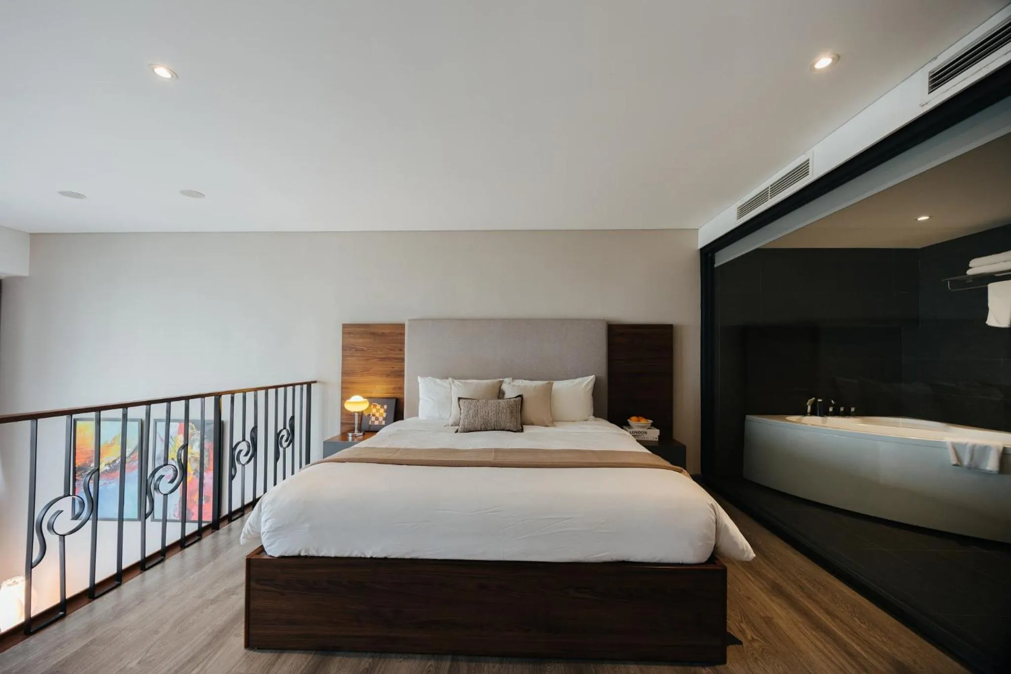 Bed in PentStudio Duplex Apartment