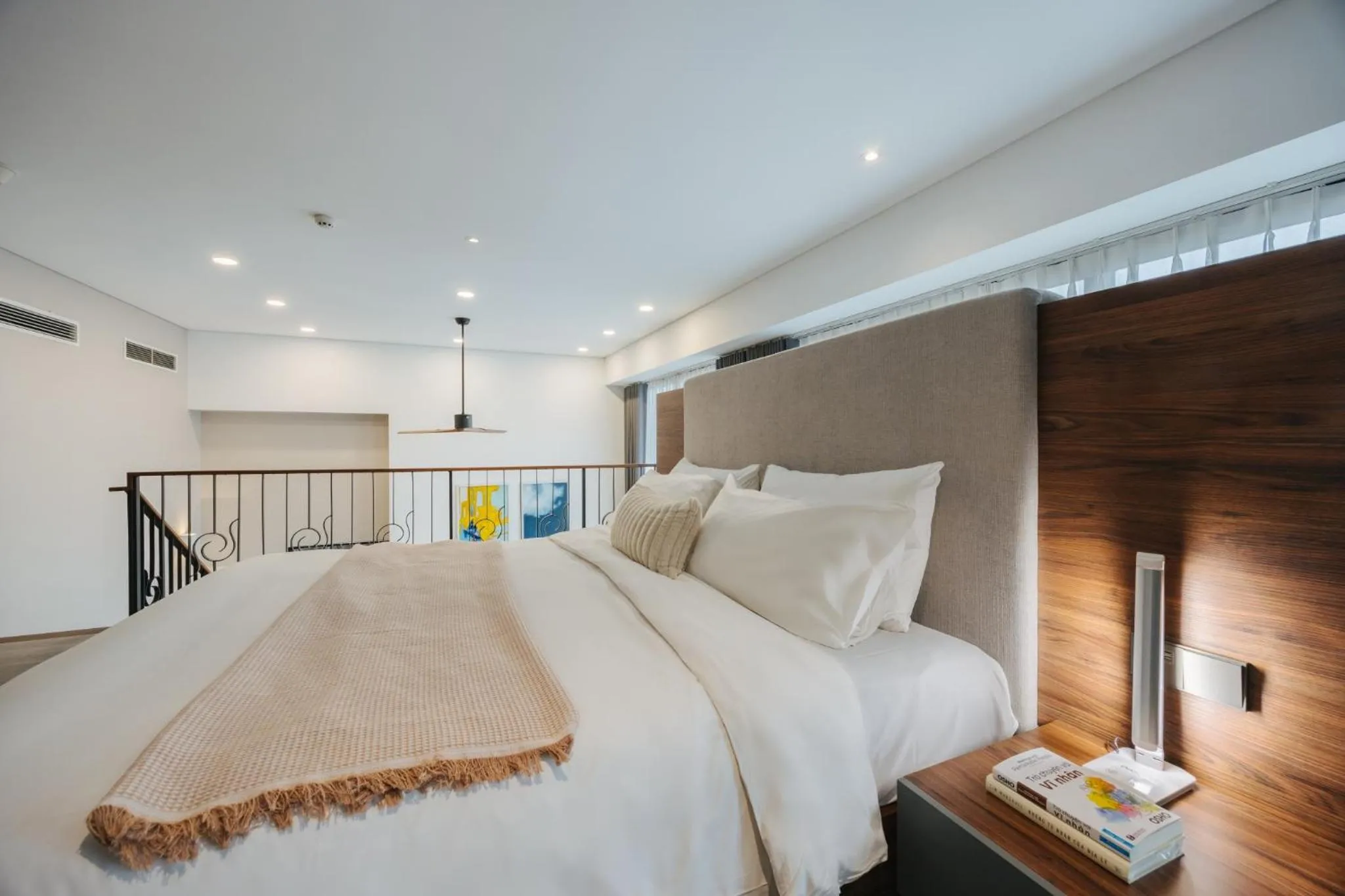 Bed in PentStudio Duplex Apartment