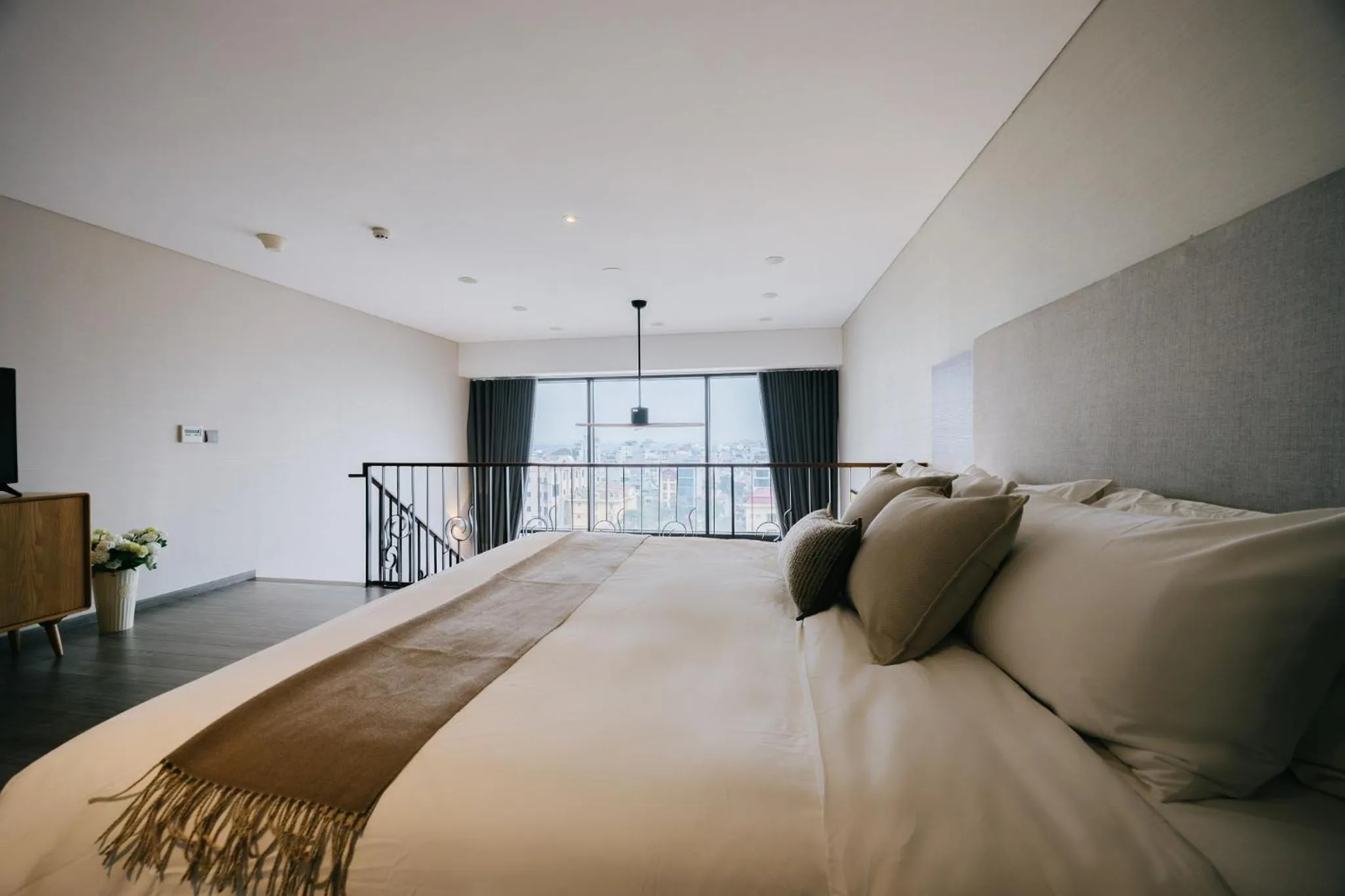 Bed in PentStudio Duplex Apartment