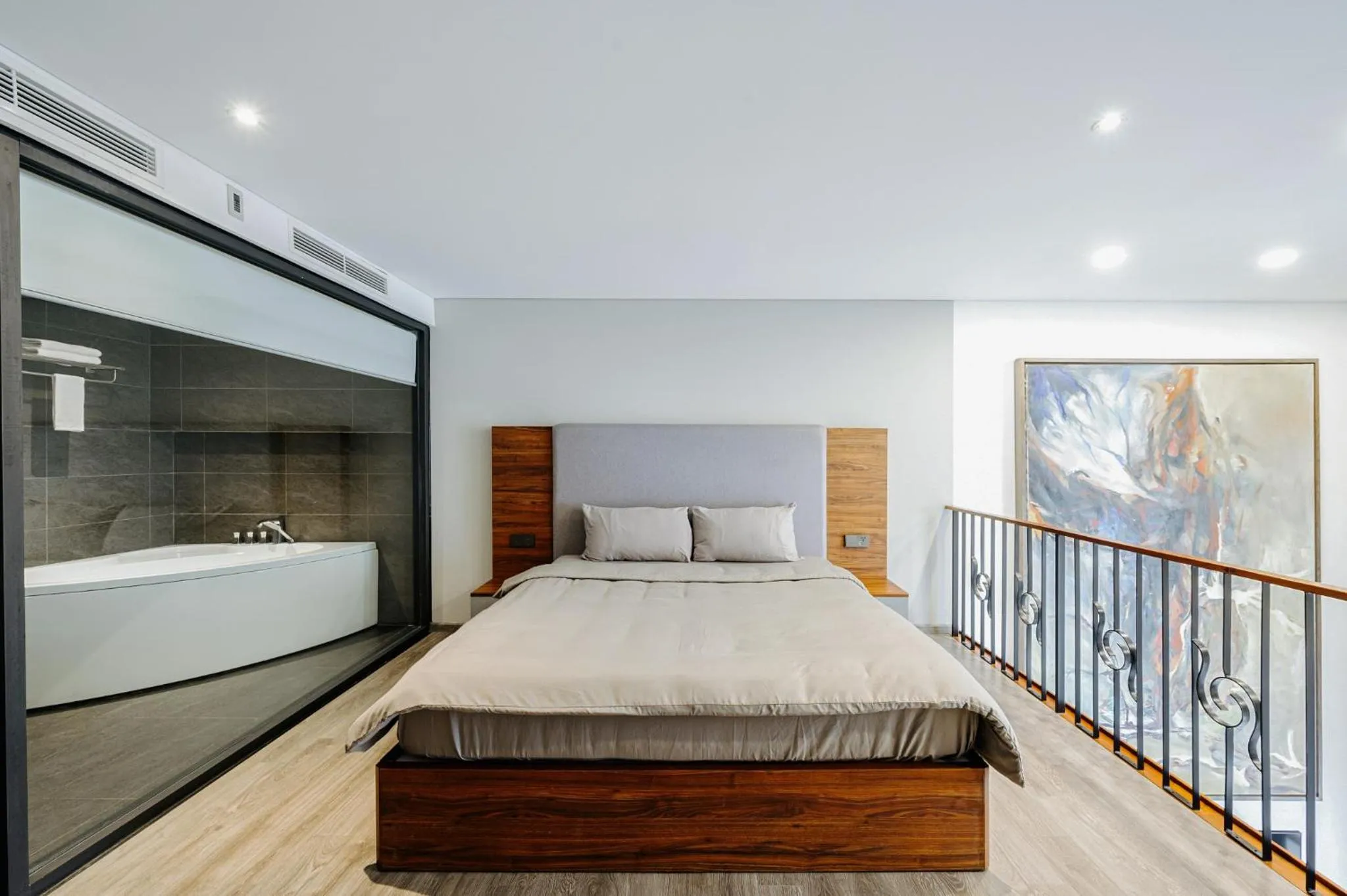 Bed in PentStudio Duplex Apartment