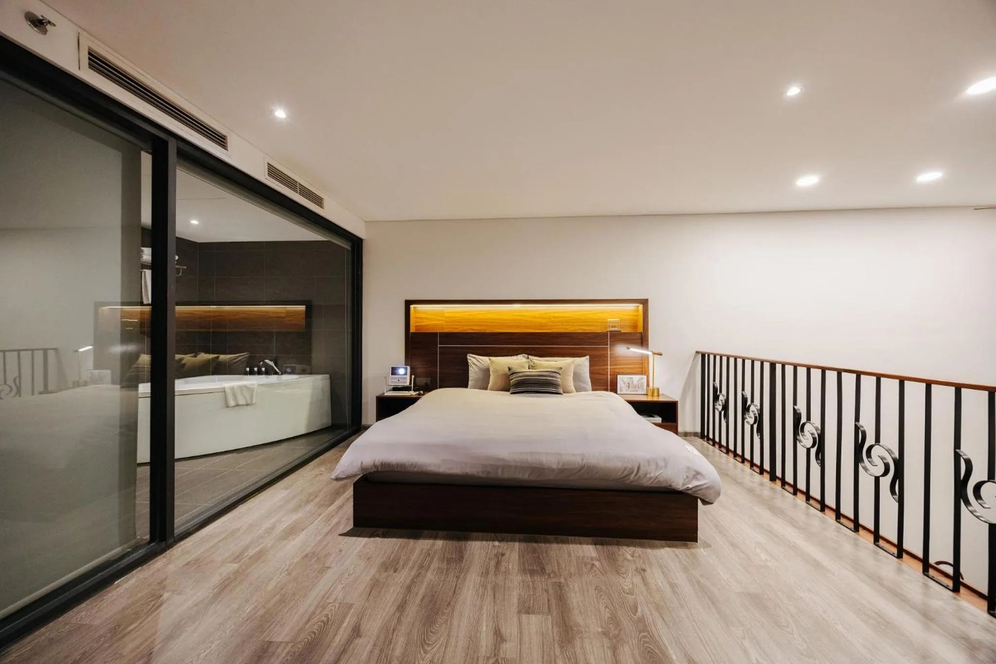 Bed in PentStudio Duplex Apartment