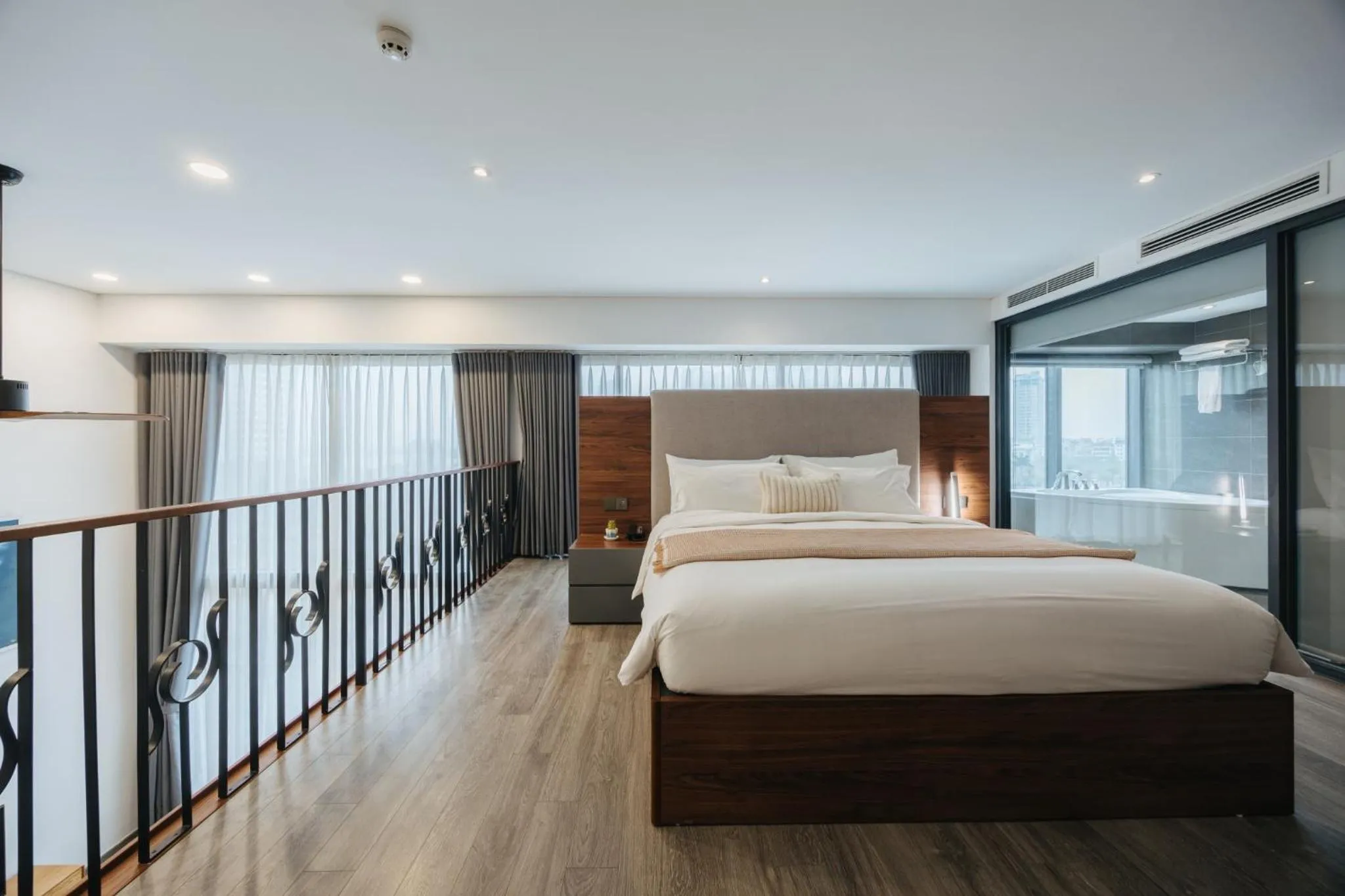 Bed in PentStudio Duplex Apartment