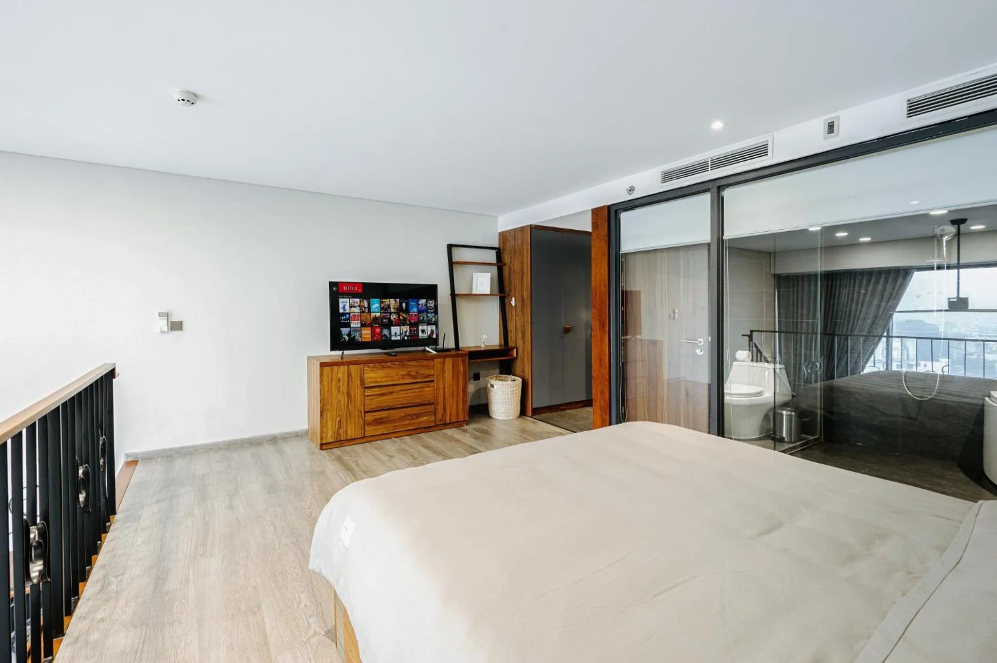 Bed in PentStudio Duplex Apartment