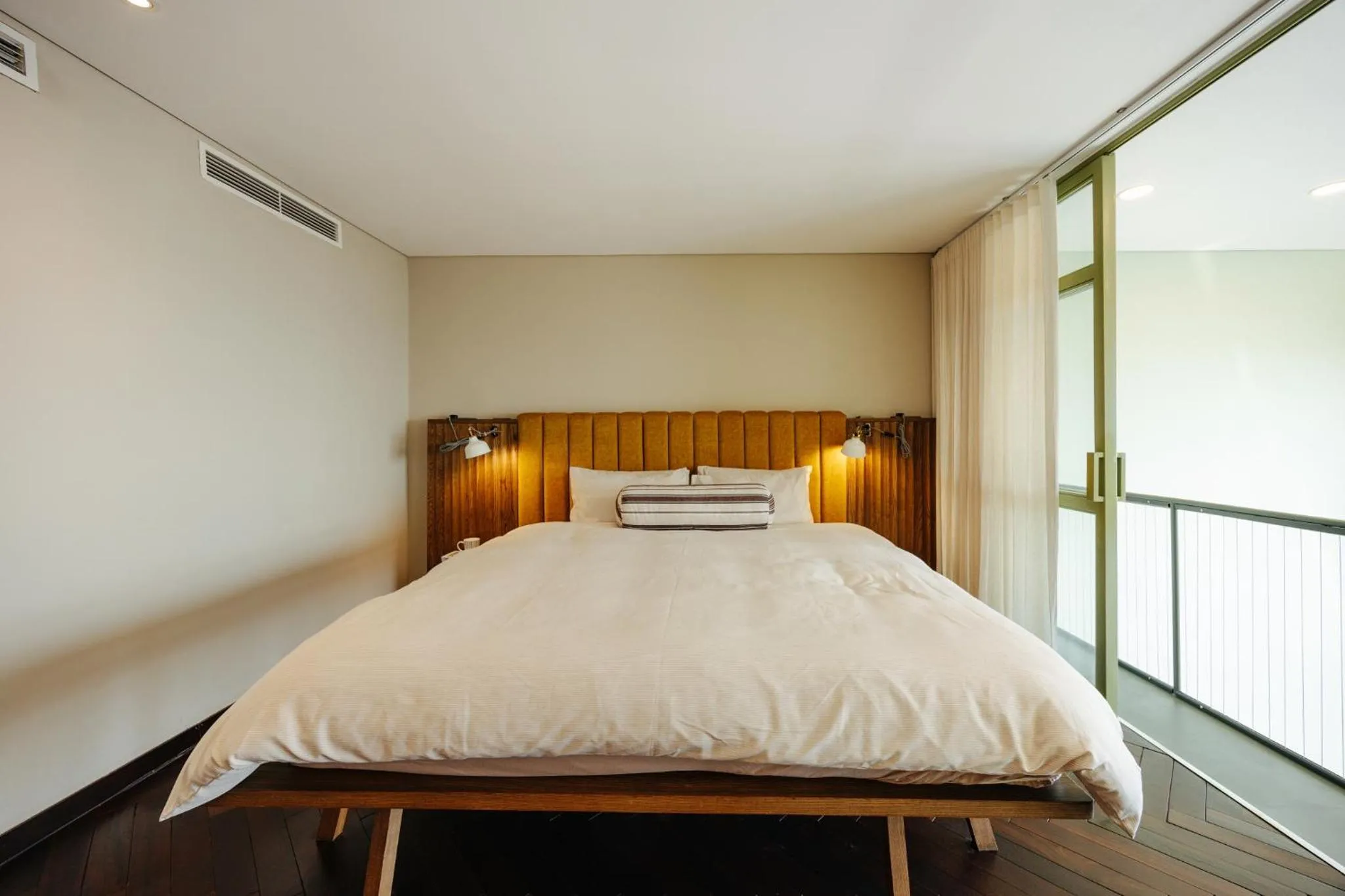 Bed in PentStudio Duplex Apartment