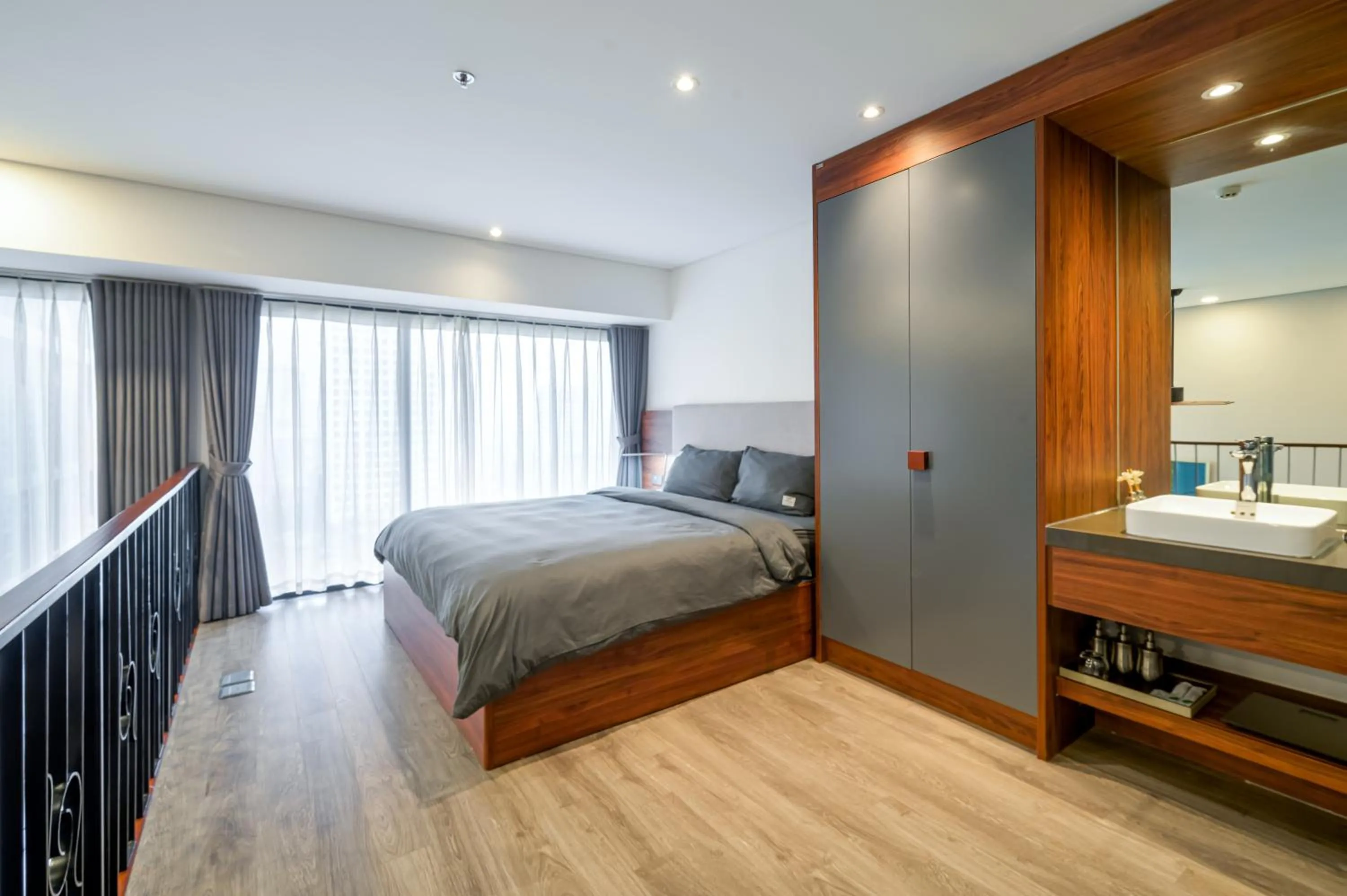 Bed in PentStudio Duplex Apartment