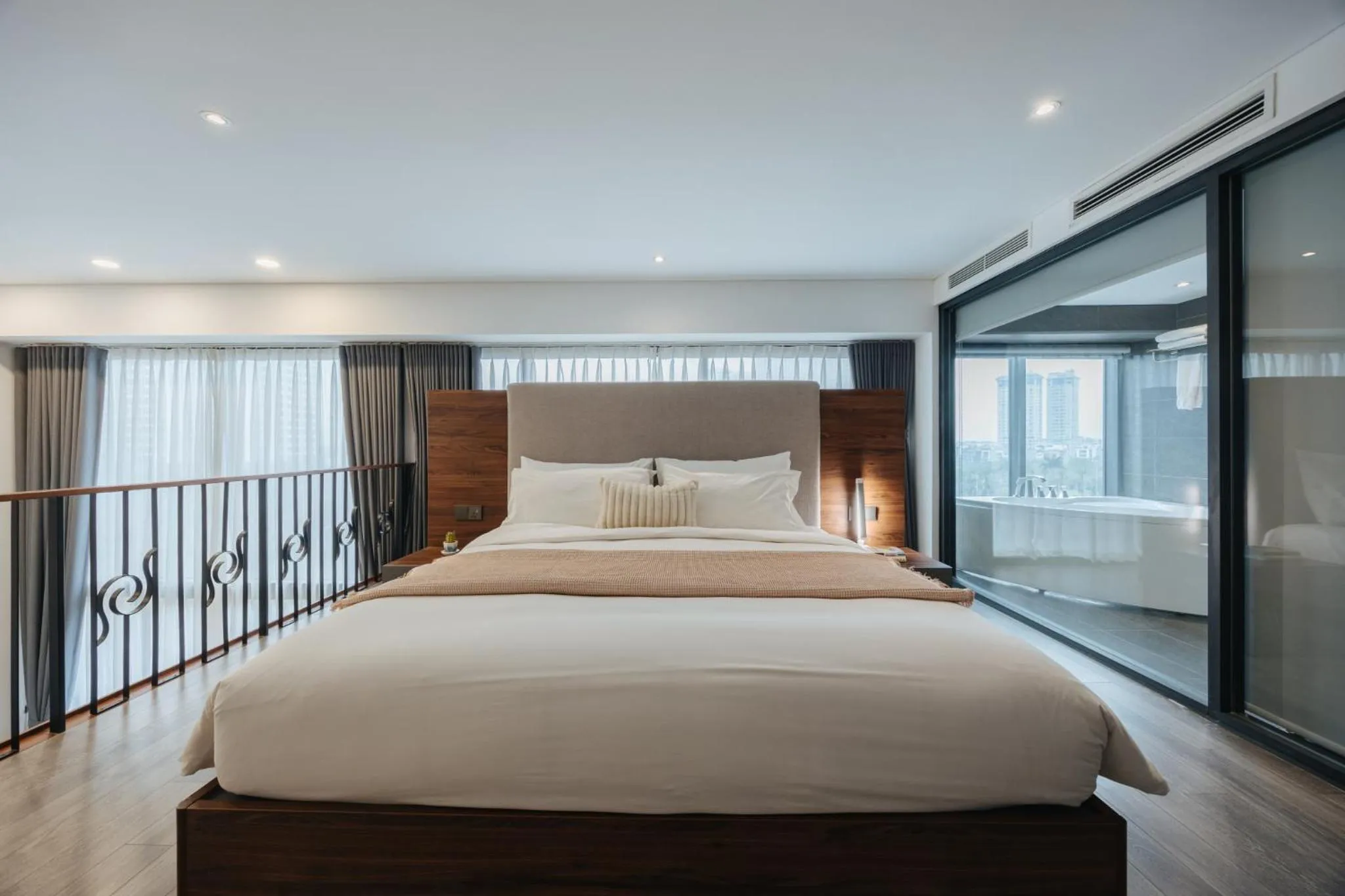 Bed in PentStudio Duplex Apartment