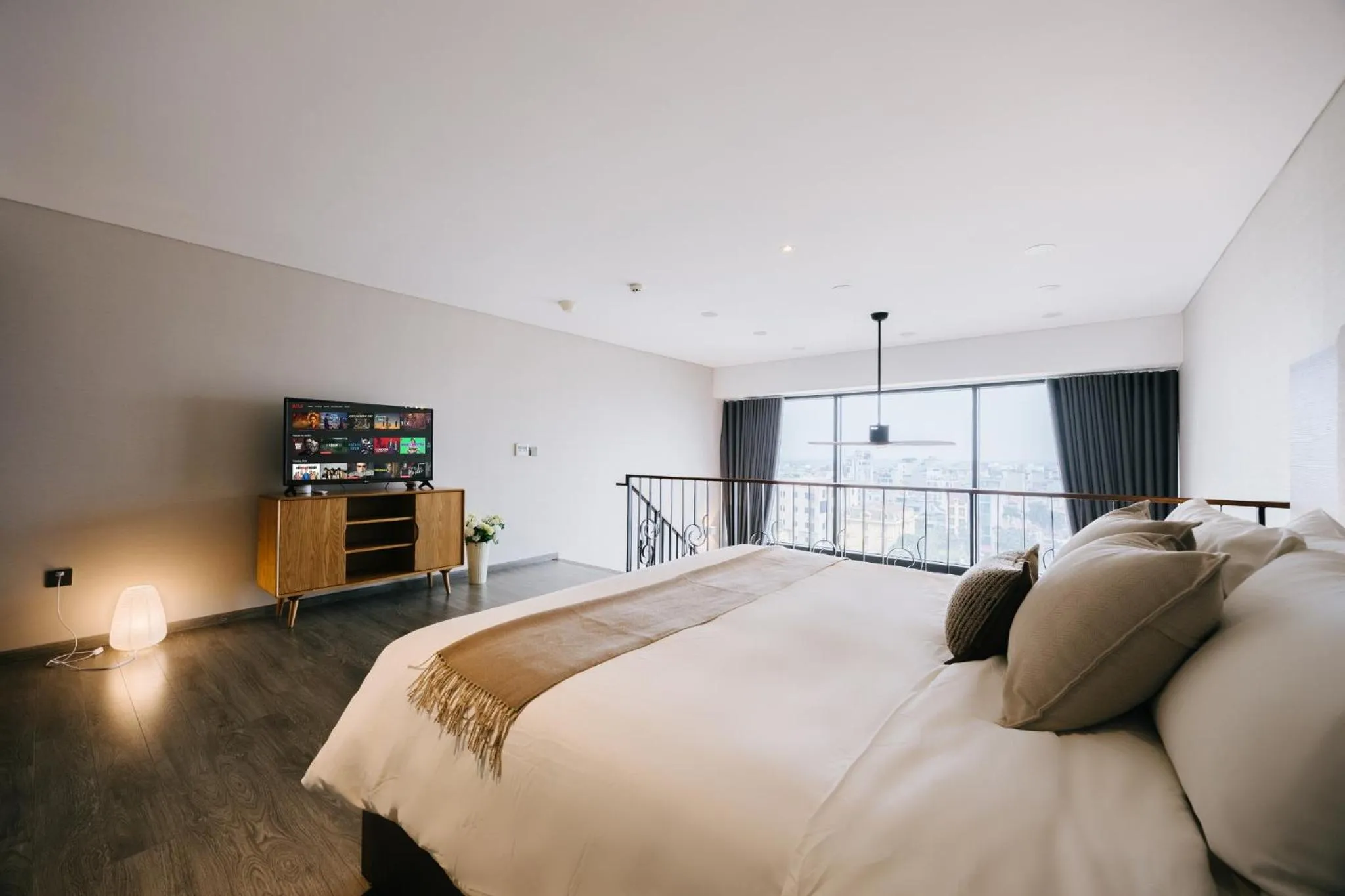 Bed in PentStudio Duplex Apartment