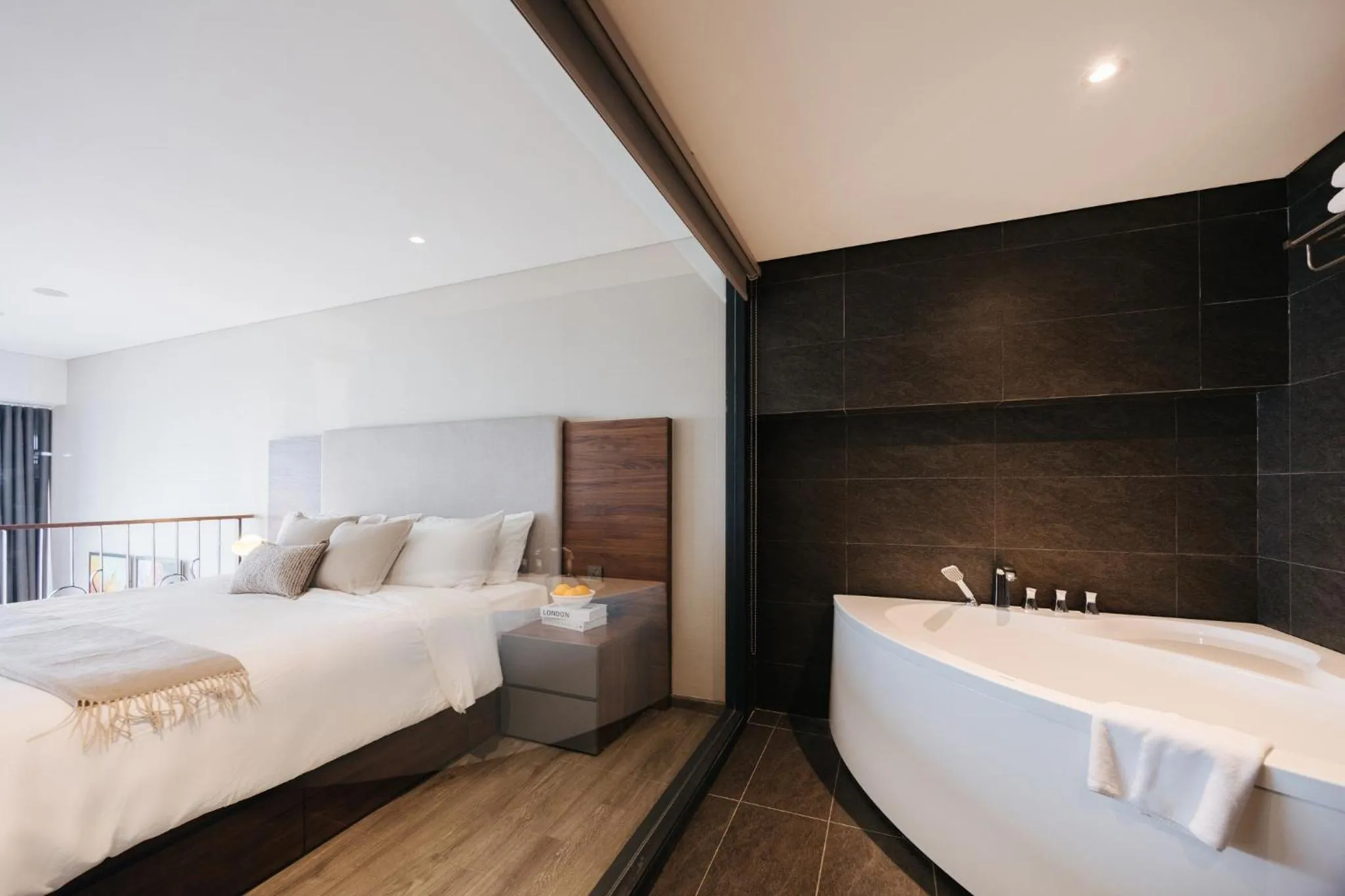 Bed in PentStudio Duplex Apartment