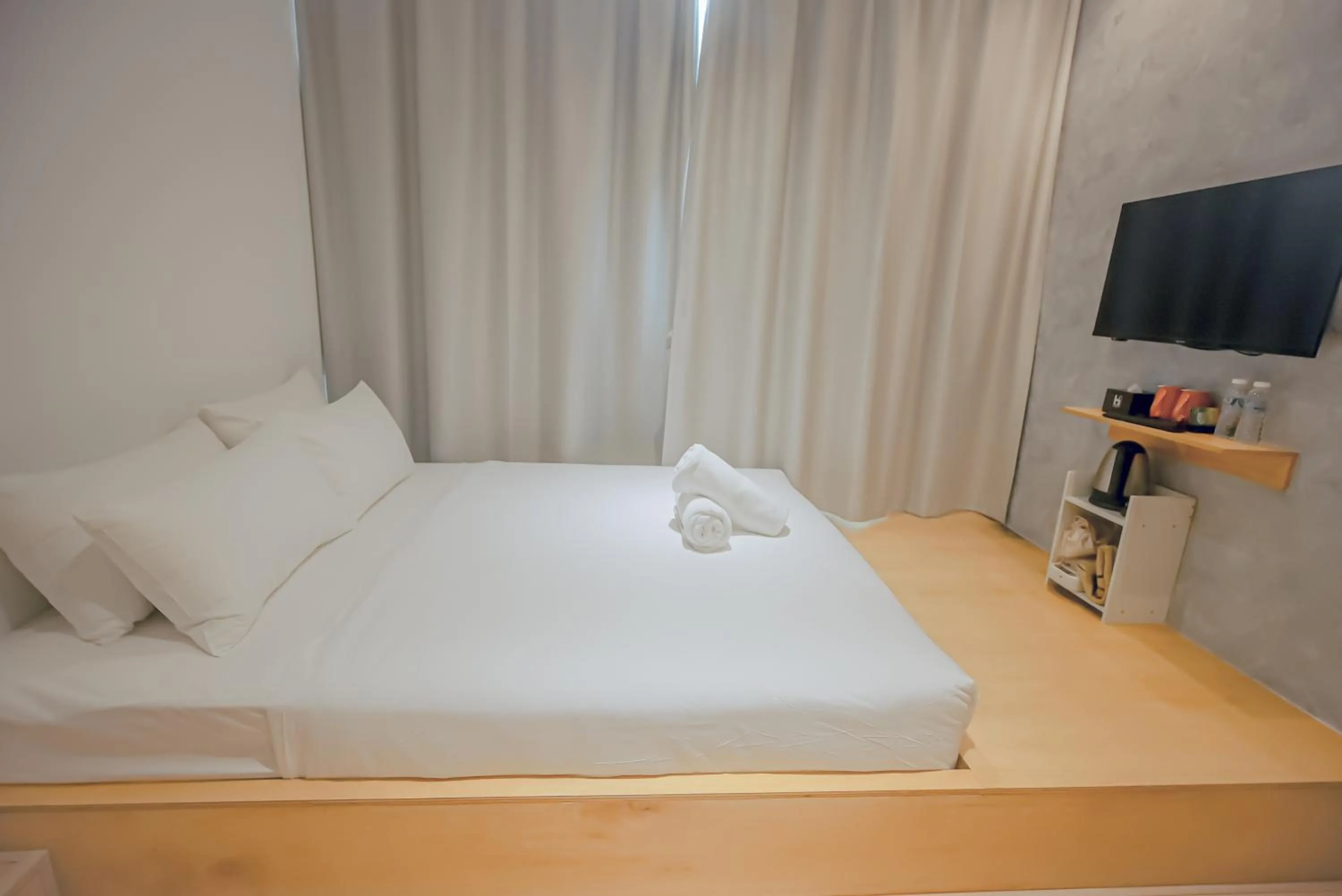 Bed in Double H Boutique Hotel