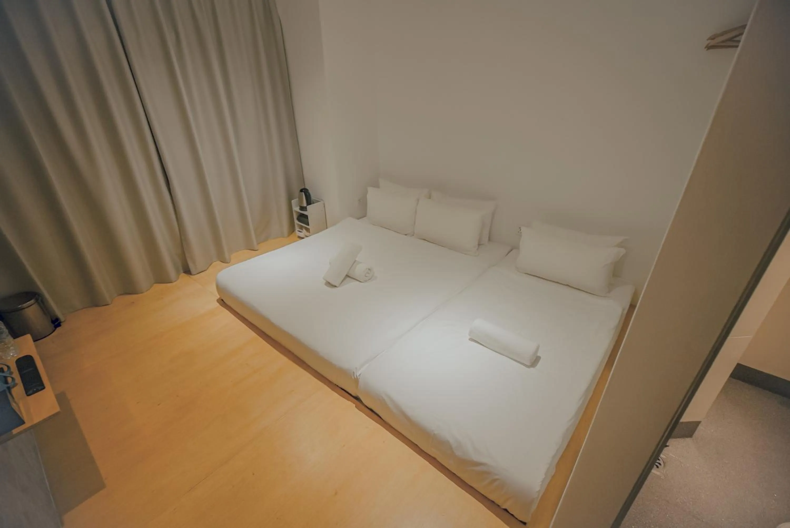 Bed in Double H Boutique Hotel