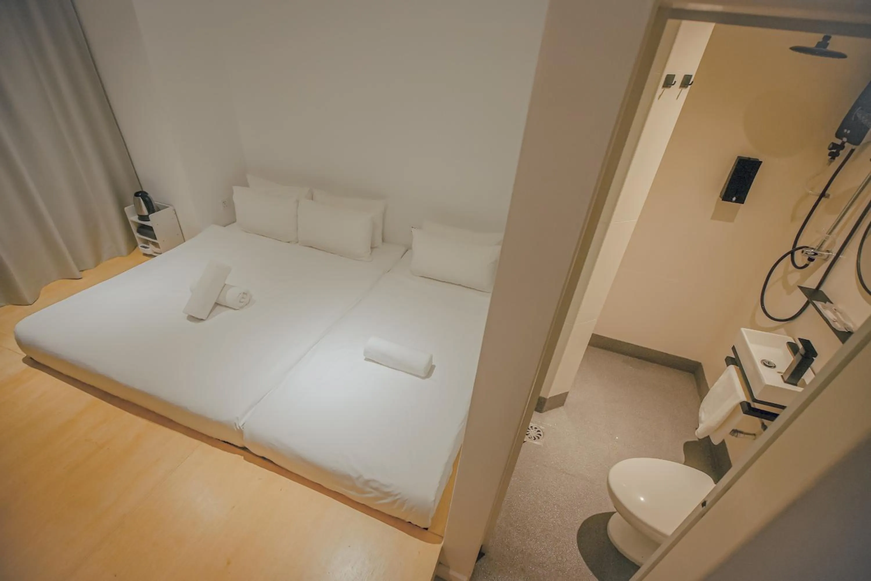 Bed in Double H Boutique Hotel