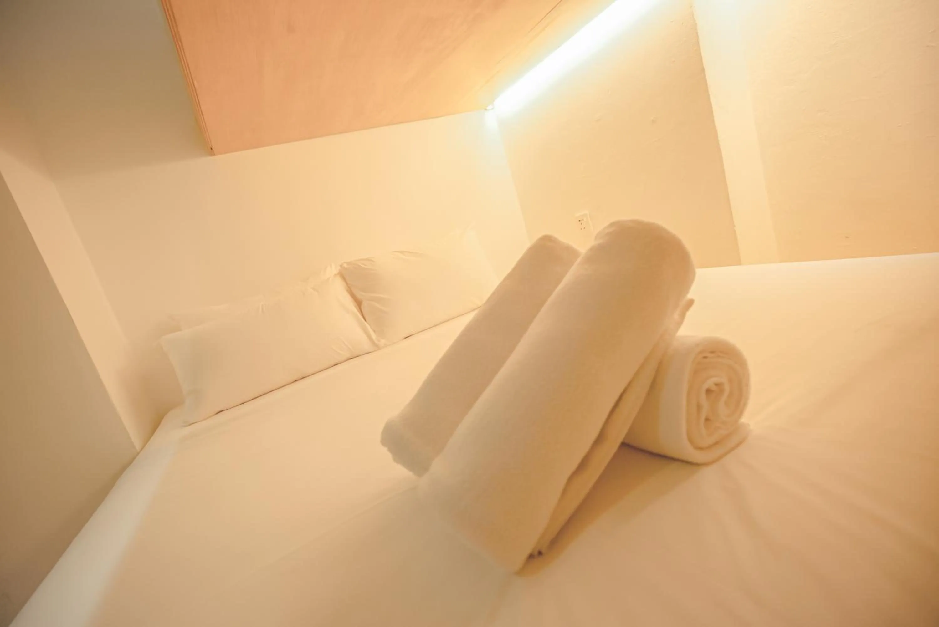 Bed in Double H Boutique Hotel